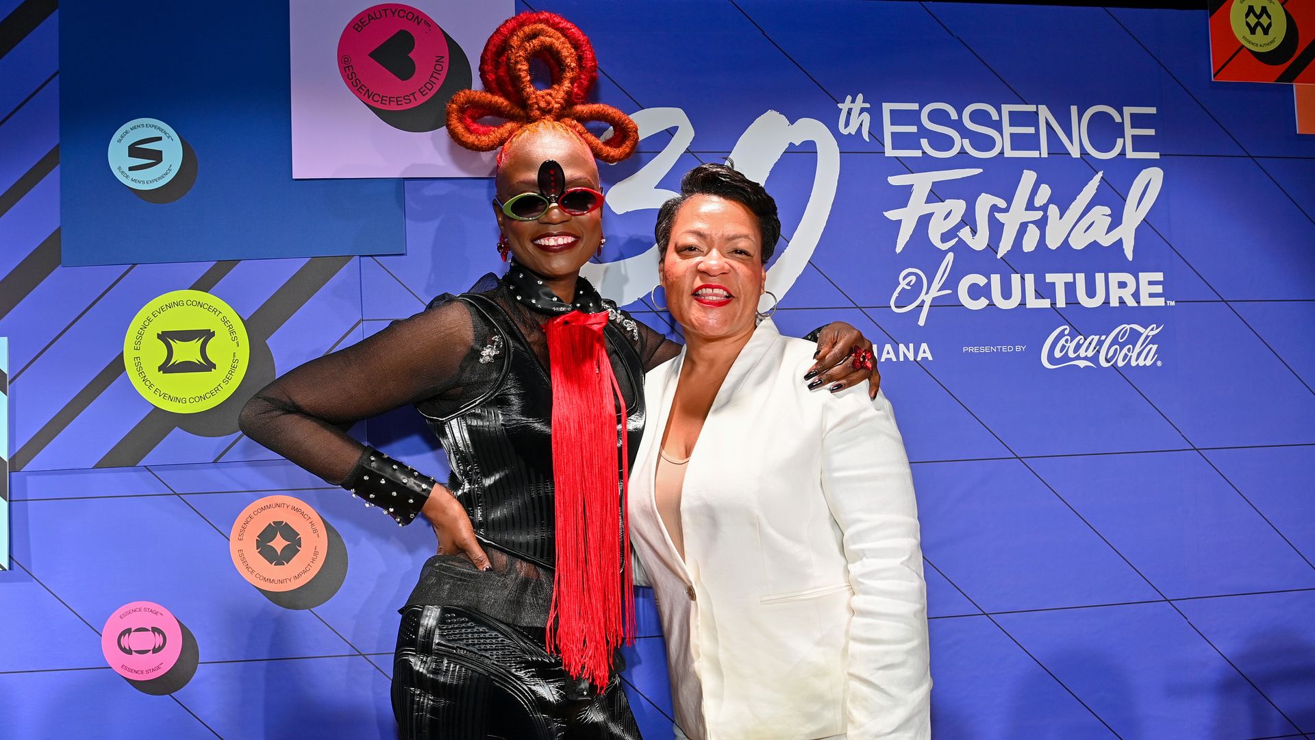 Photo shows Carolina Wanga and Mayor LaToya Cantrell hugging.