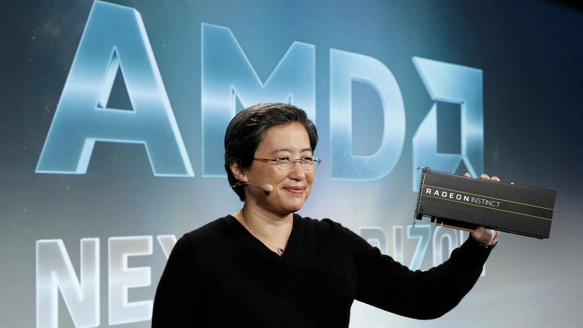 AMD CEO Lisa Su, holding up AMD's next-generation graphics chip for the data center.