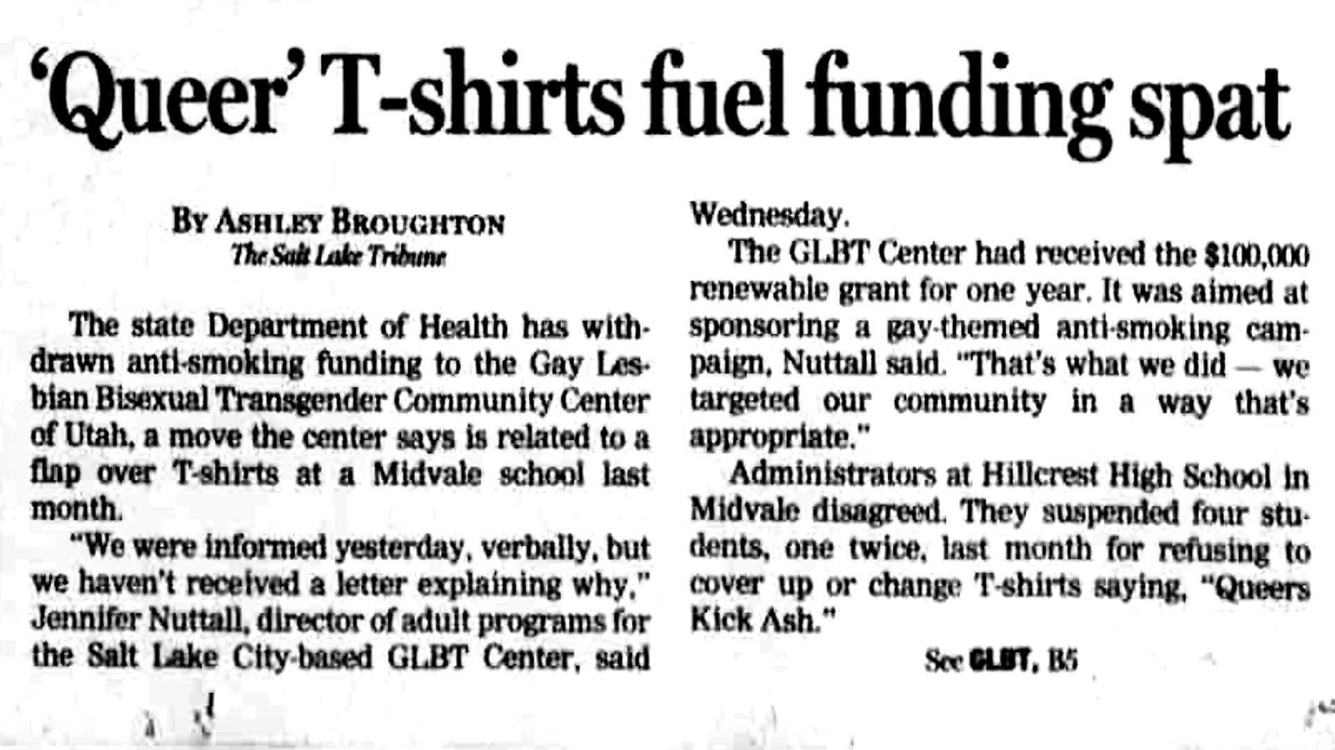 An old newspaper article is headlined "'Queer' T-shirts fel funding spat."