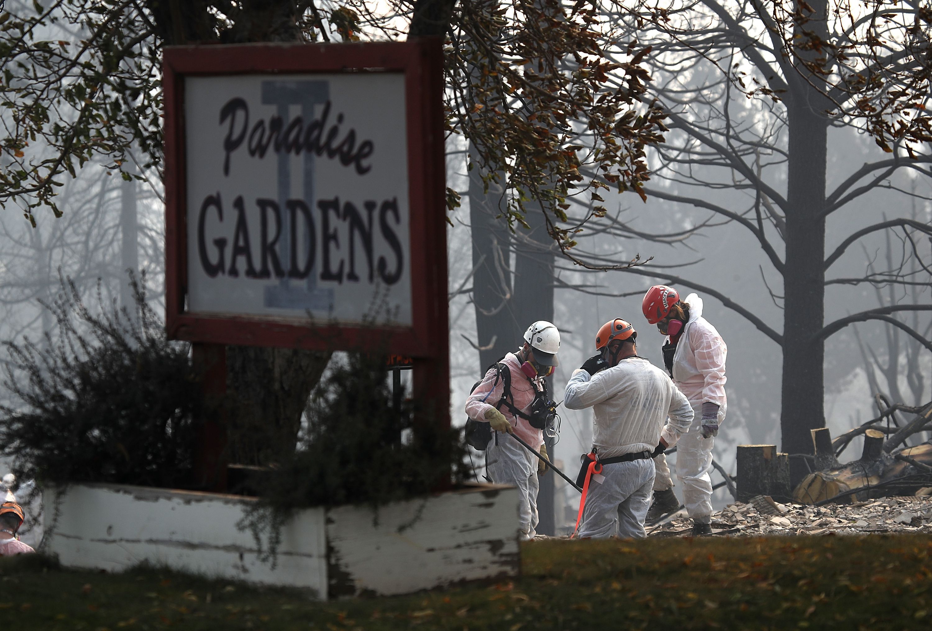 Rescue workers search the Paradise Gardens apartments for victims of the Camp Fire. 
