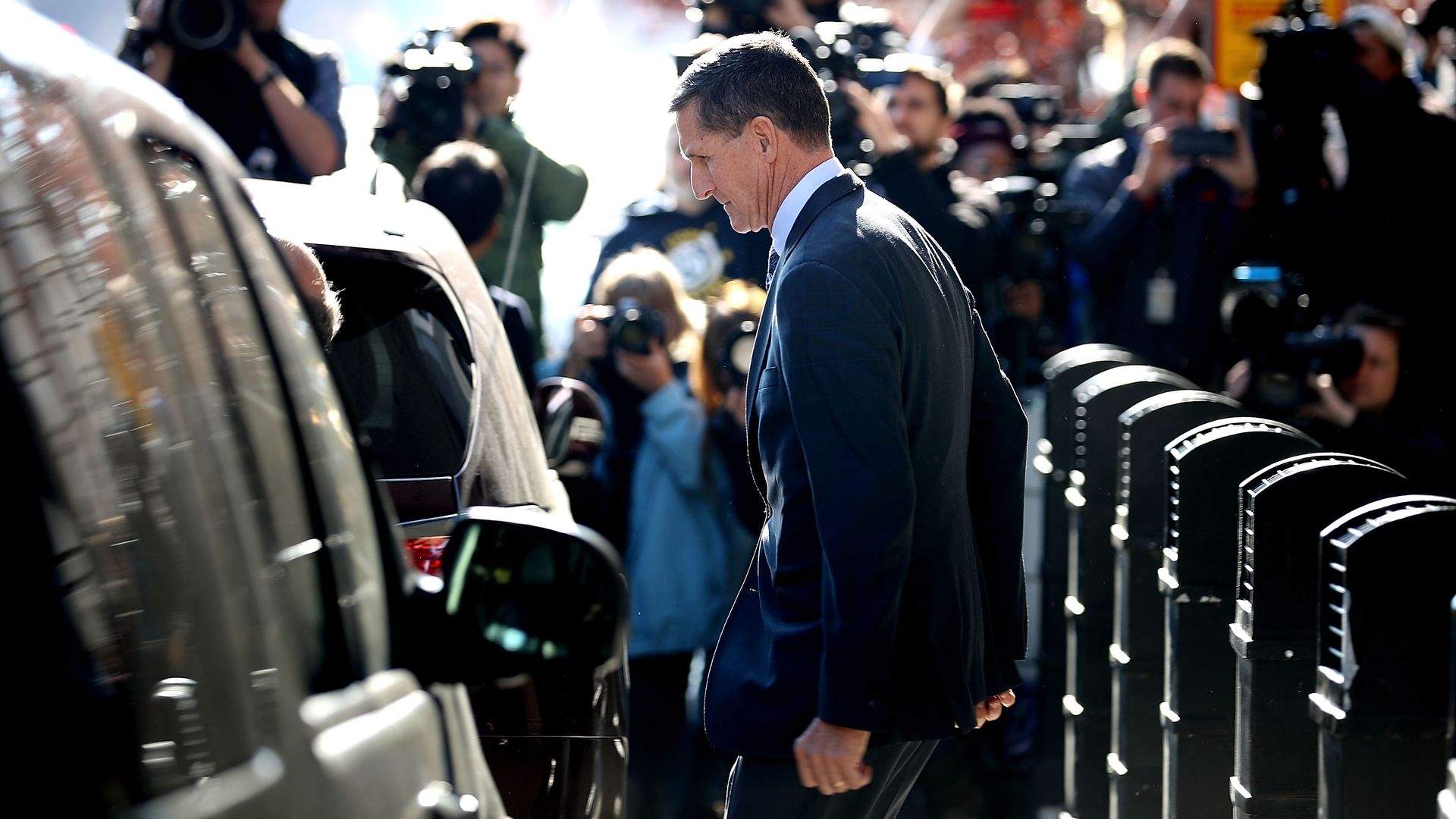 Michael Flynn, former national security advisor to President Donald Trump, leaves following his plea hearing