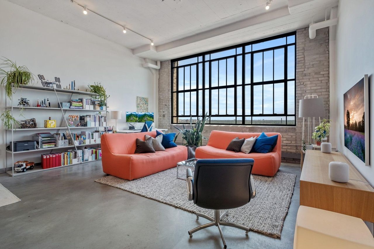 open concept living room with large windows