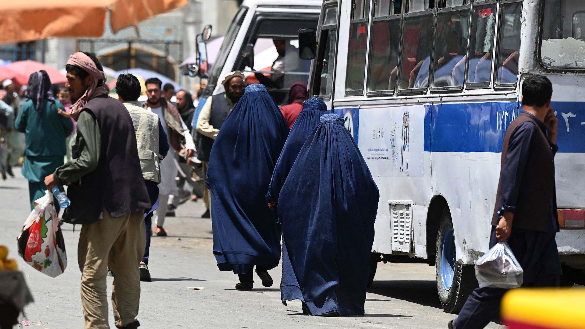 People walking near a market in Kabul on July 21.