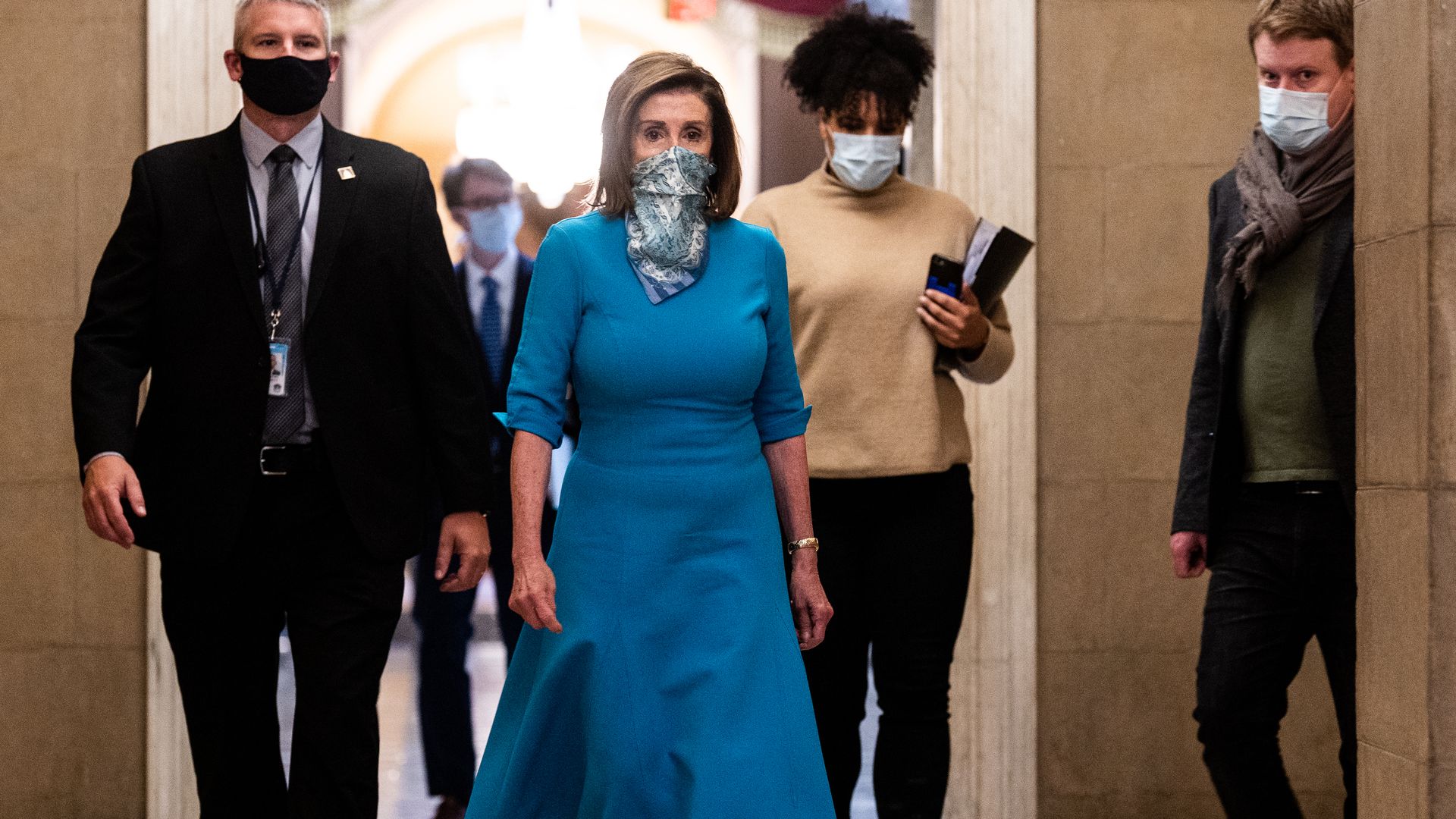 Speaker Nancy Pelosi walks to her office after her weekly press conference.