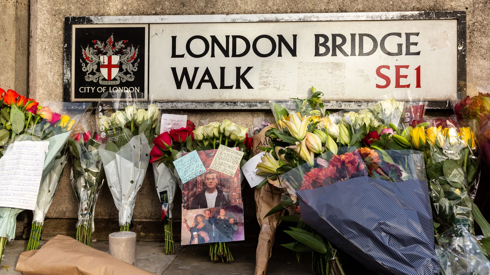 Members of public leave flowers and goodbye notes at the scene of November 29