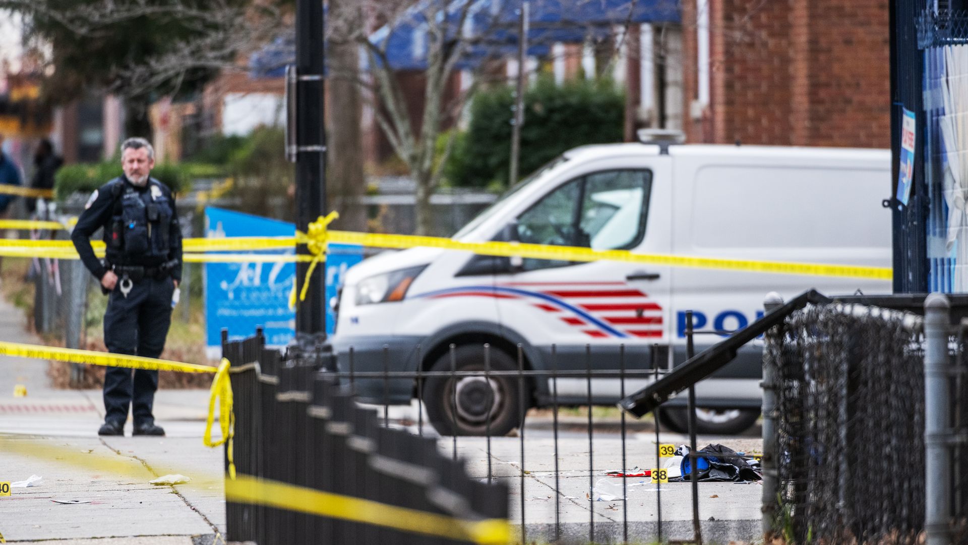 A D.C.police officer stands at a crime scene