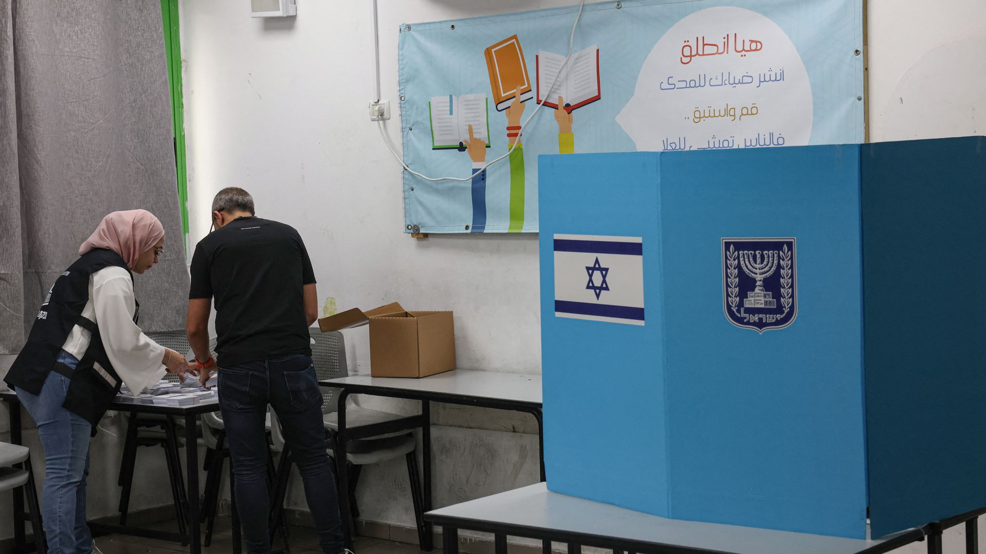 Election officials prepare a polling station for voters in the Arab-Israeli town of Umm al-Fahm on Tuesday.