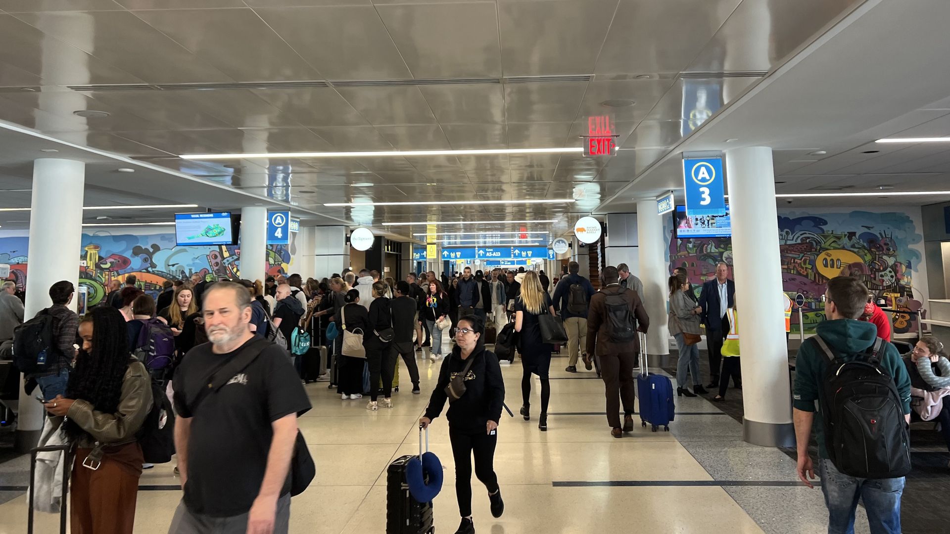 People walk through airport