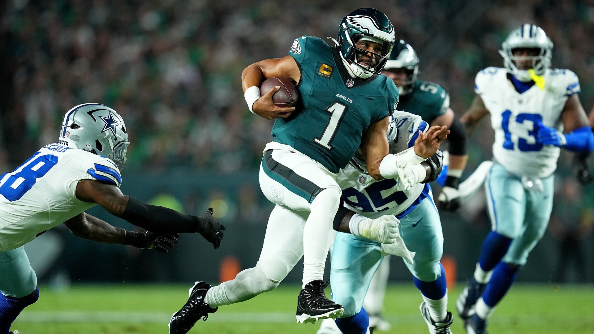 Eagles quarterback Jalen Hurts scrambles against the Dallas Cowboys in the season-opener at the Linc.
