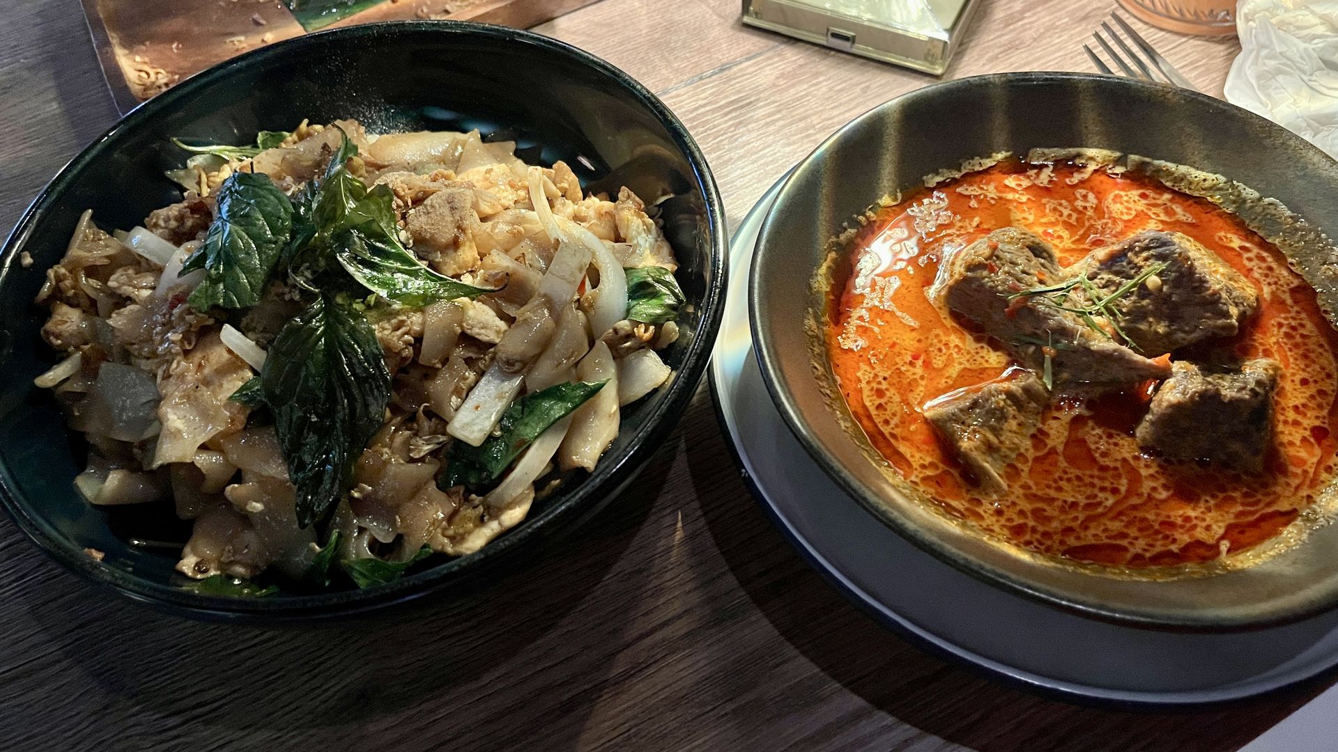 Two plates of Thai food. 