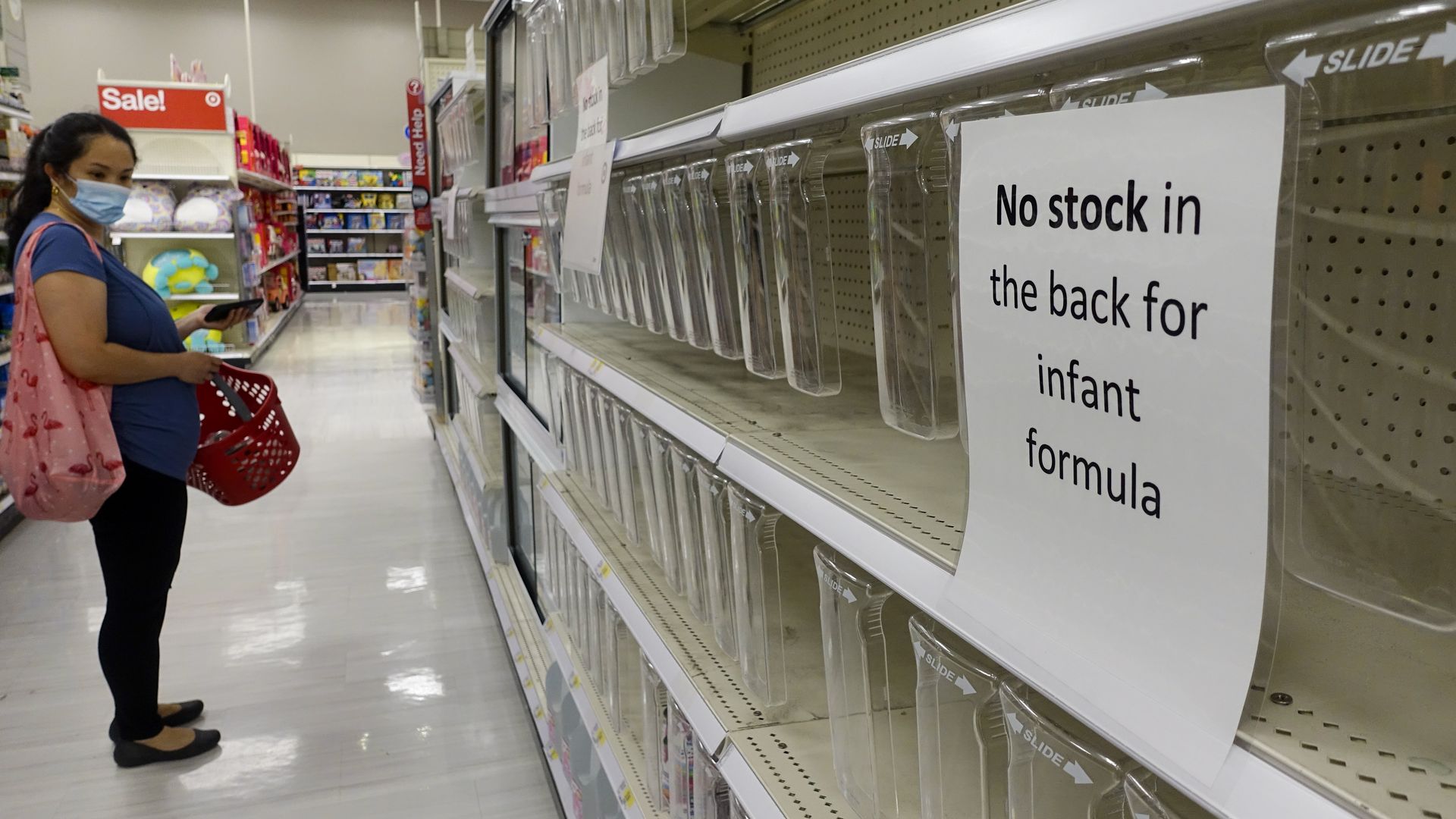 A sign on an empty shelf informs customers that there is no stock in the back for infant formula