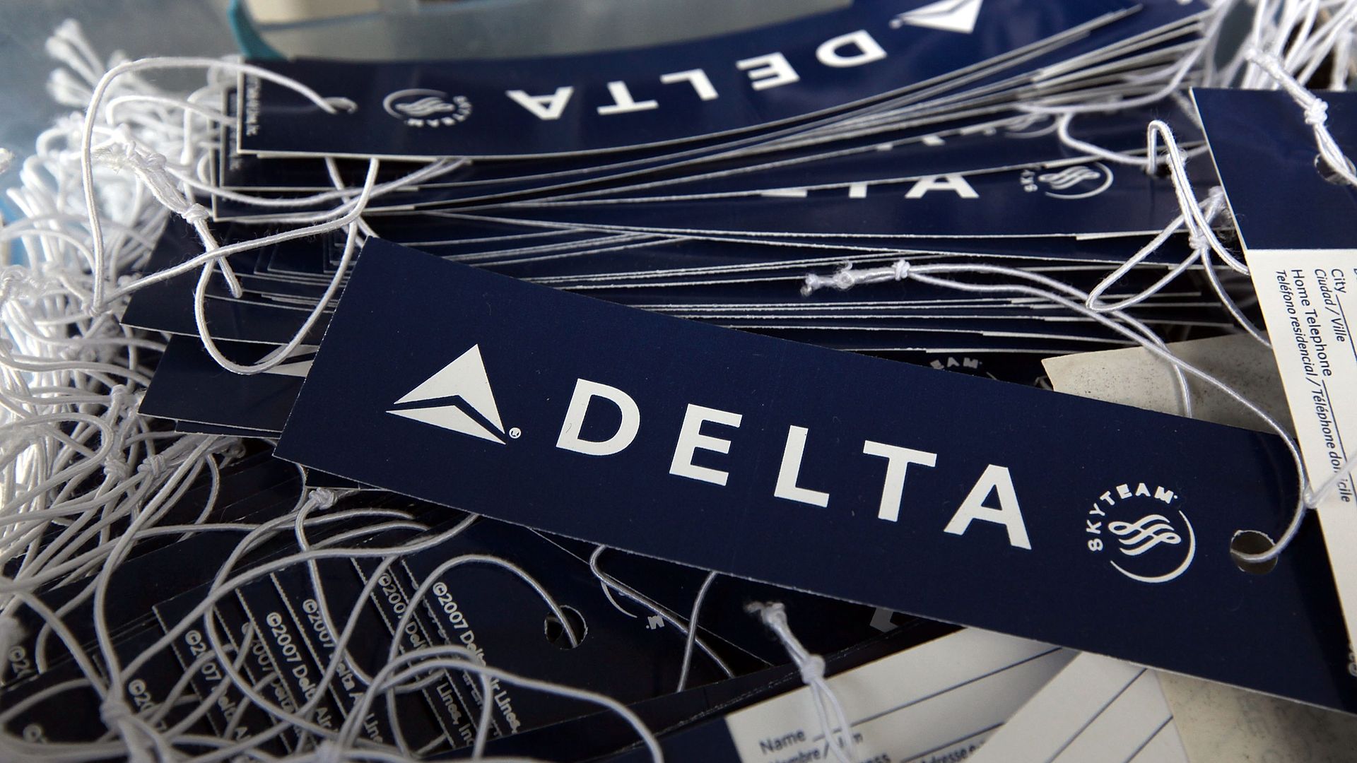 A pile of airline bag tags.