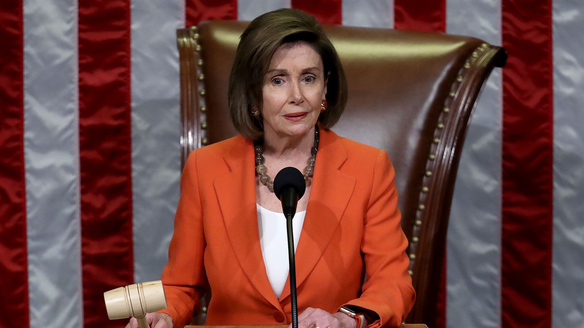 Nancy Pelosi holds the gavel at the House.
