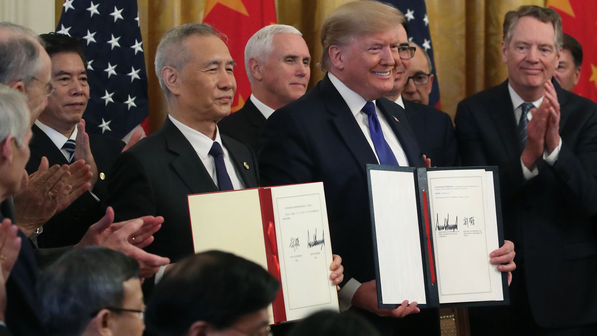 A photo of President Trump and Vice Premier Liu He holding signed copies of the U.S.-China trade deal.