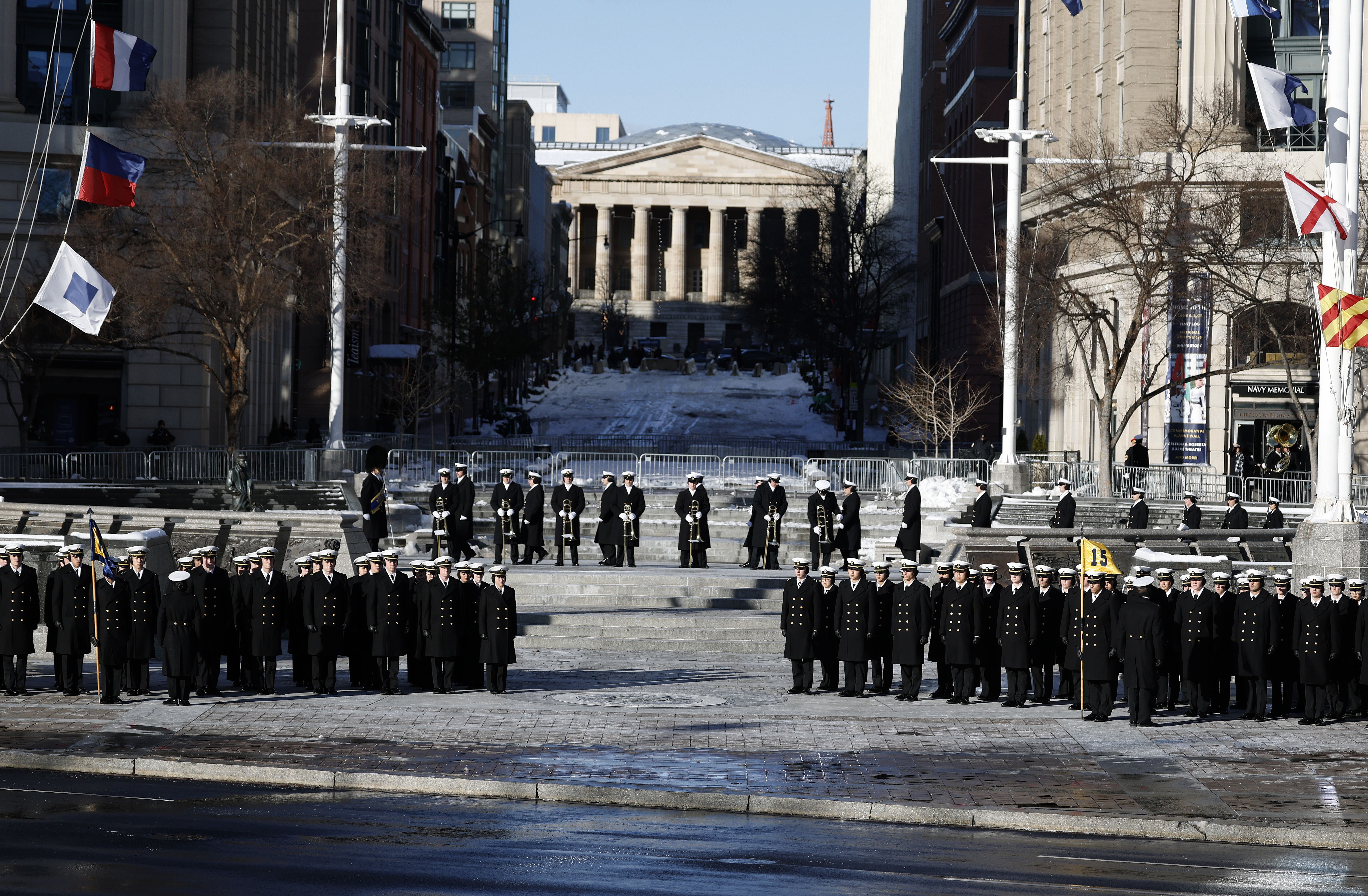 Members of the U.S. Navy await the casket of former U.S. President Jimmy Carter for a stop at the U.S. Navy Memorial before traveling to the U.S. Capitol on January 07, 2025 in Washington, DC. Carter's body will lie in state in the Capitol Rotunda until a funeral service at the National Cathedral in