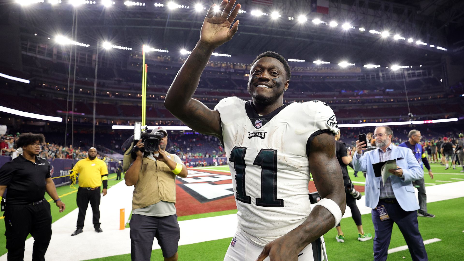 Eagles wide receiver A.J. Brown waves to fans after a game.