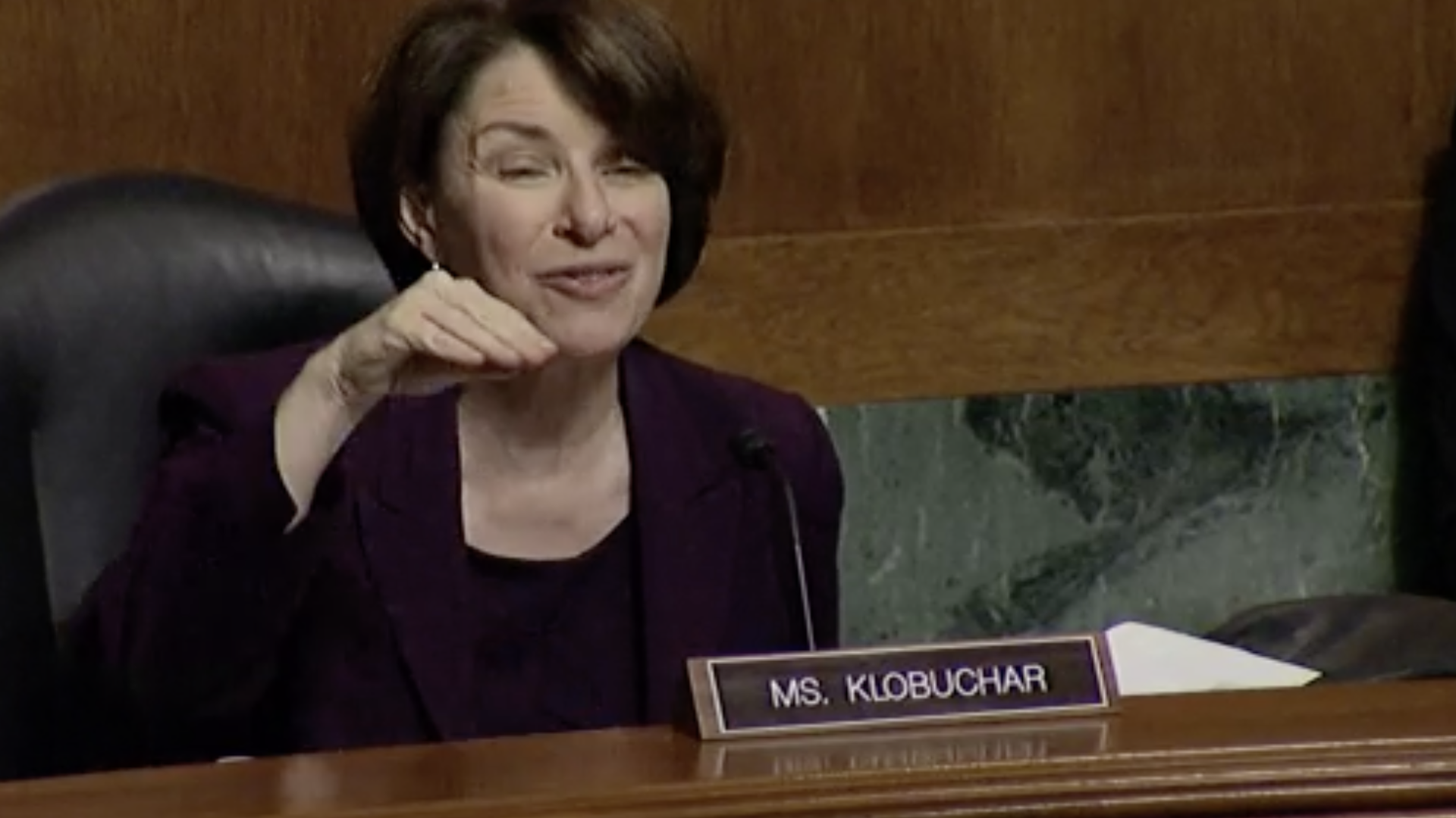 Sen. Amy Klobuchar presides over a Senate committee hearing on mobile app stores.