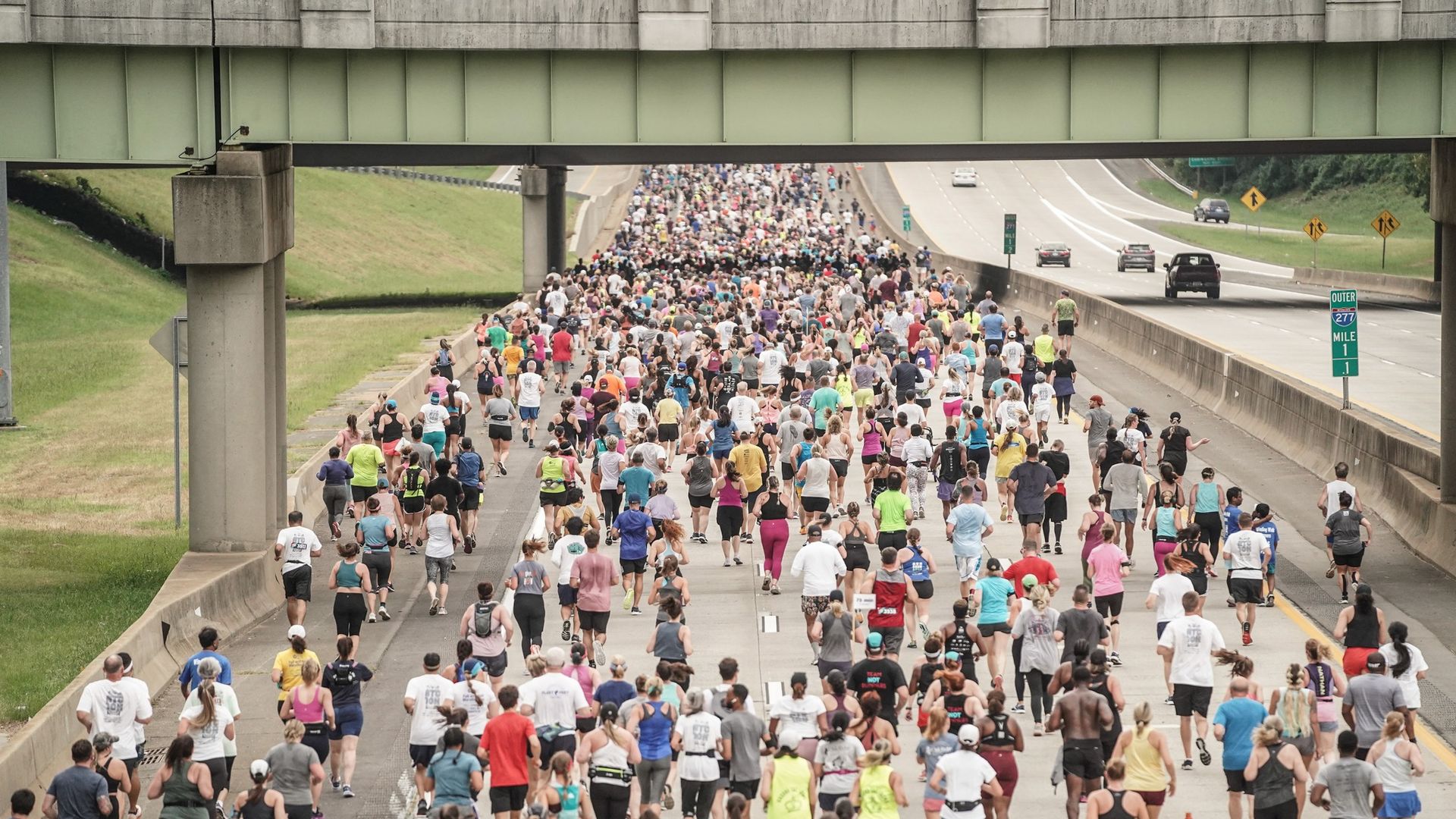 people running on the highway