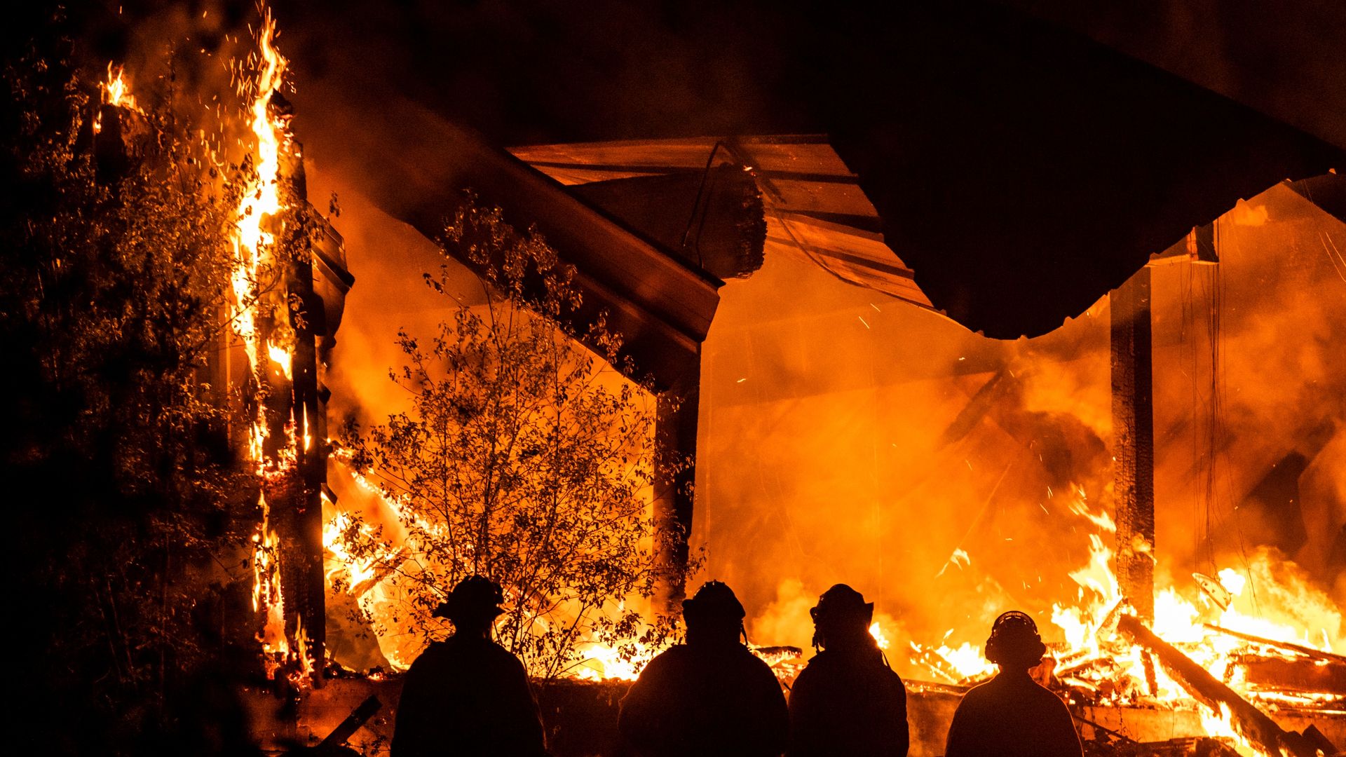 Firefighters watch as the Kincade fire burns in Healdsburg, California in October 2019.