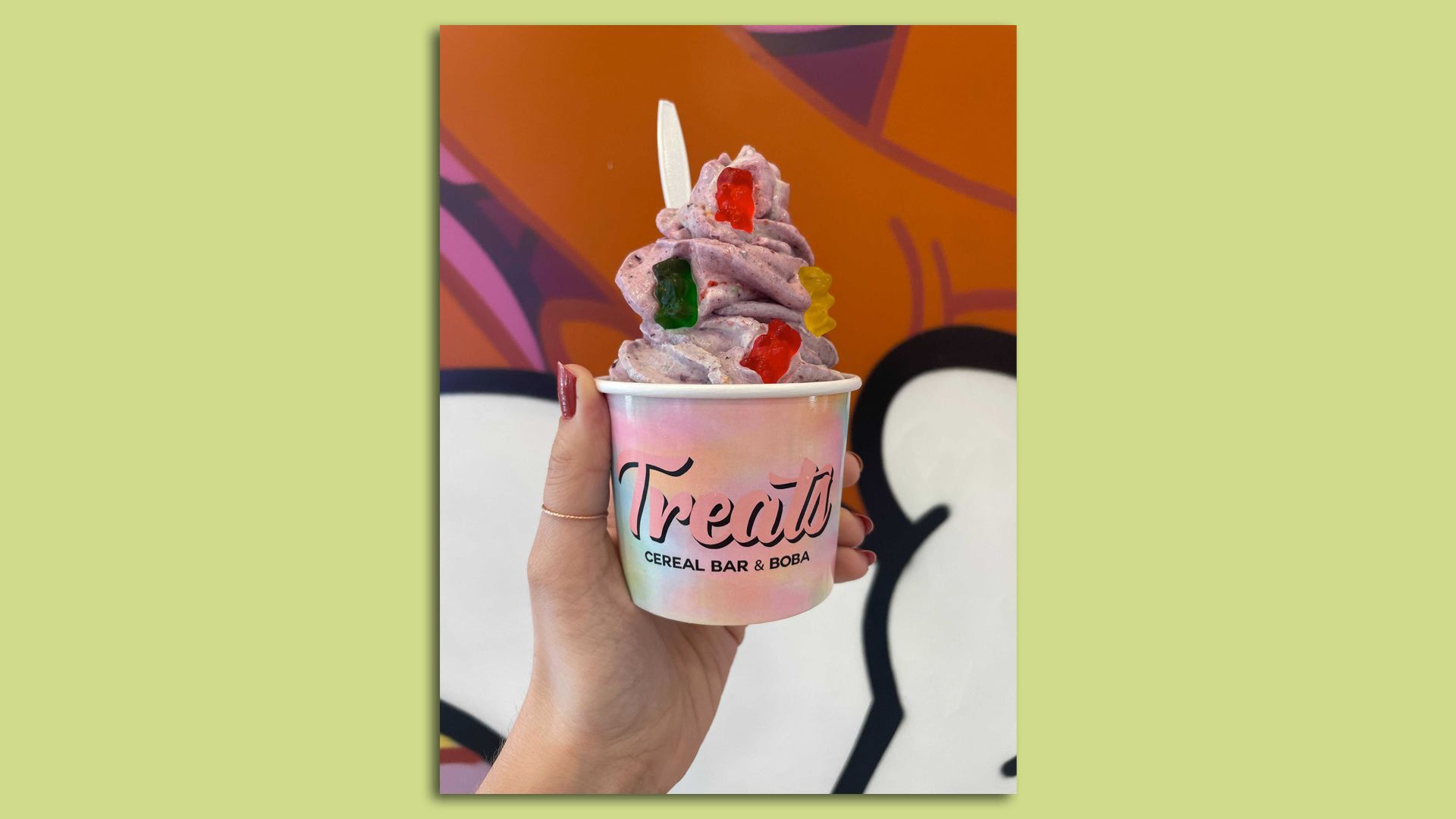 A cup of Berry Kiss ice cream topped with gummy bears from Treats Cereal Bar in St. Paul.