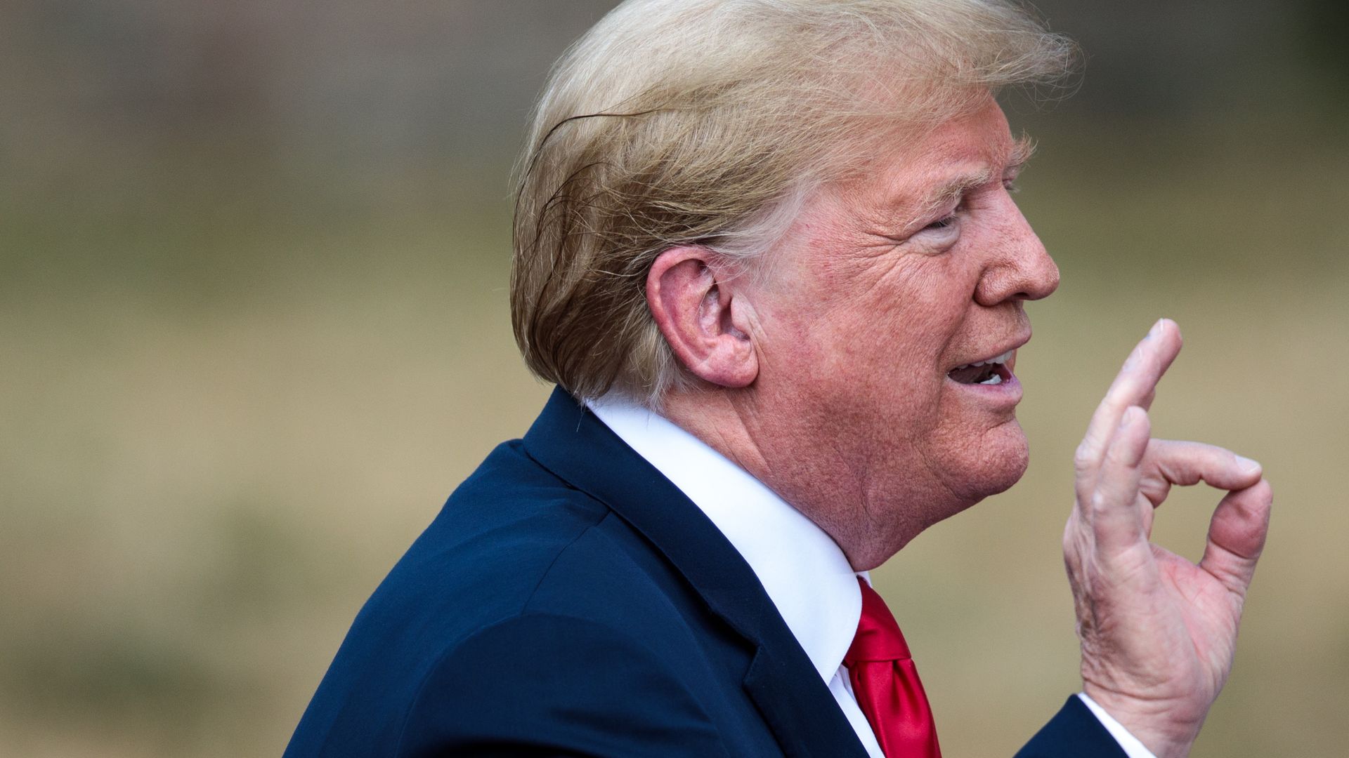 Trump speaking with his distinctive hand gestures