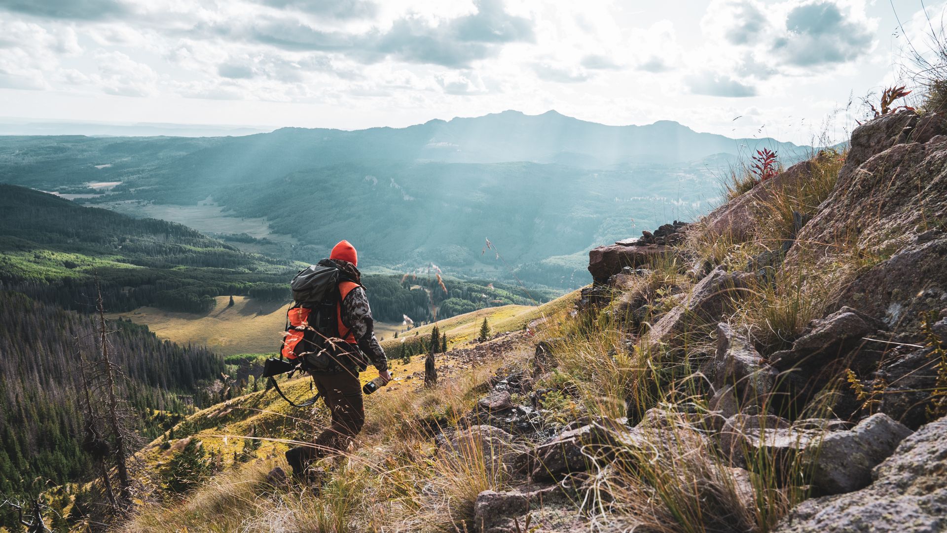 A hunter walking on a mountain