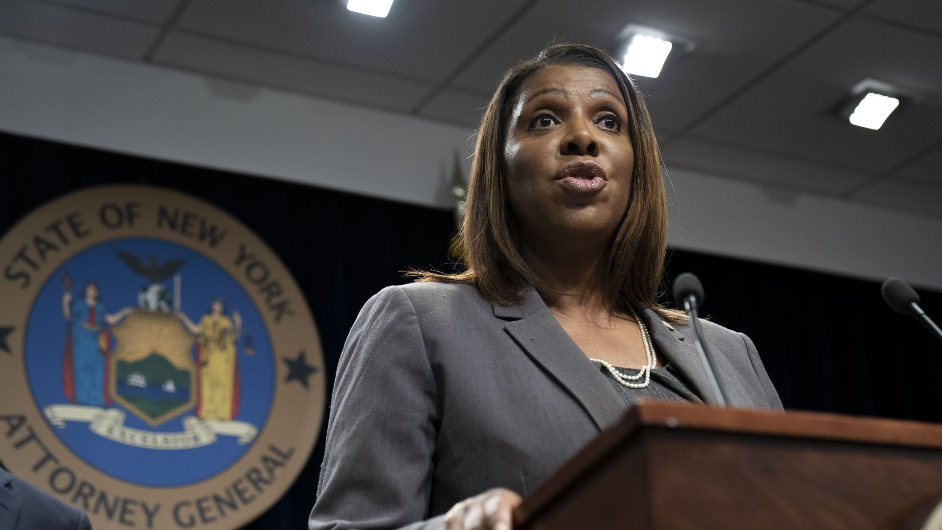 New York Attorney General Letitia James speaks at a podium