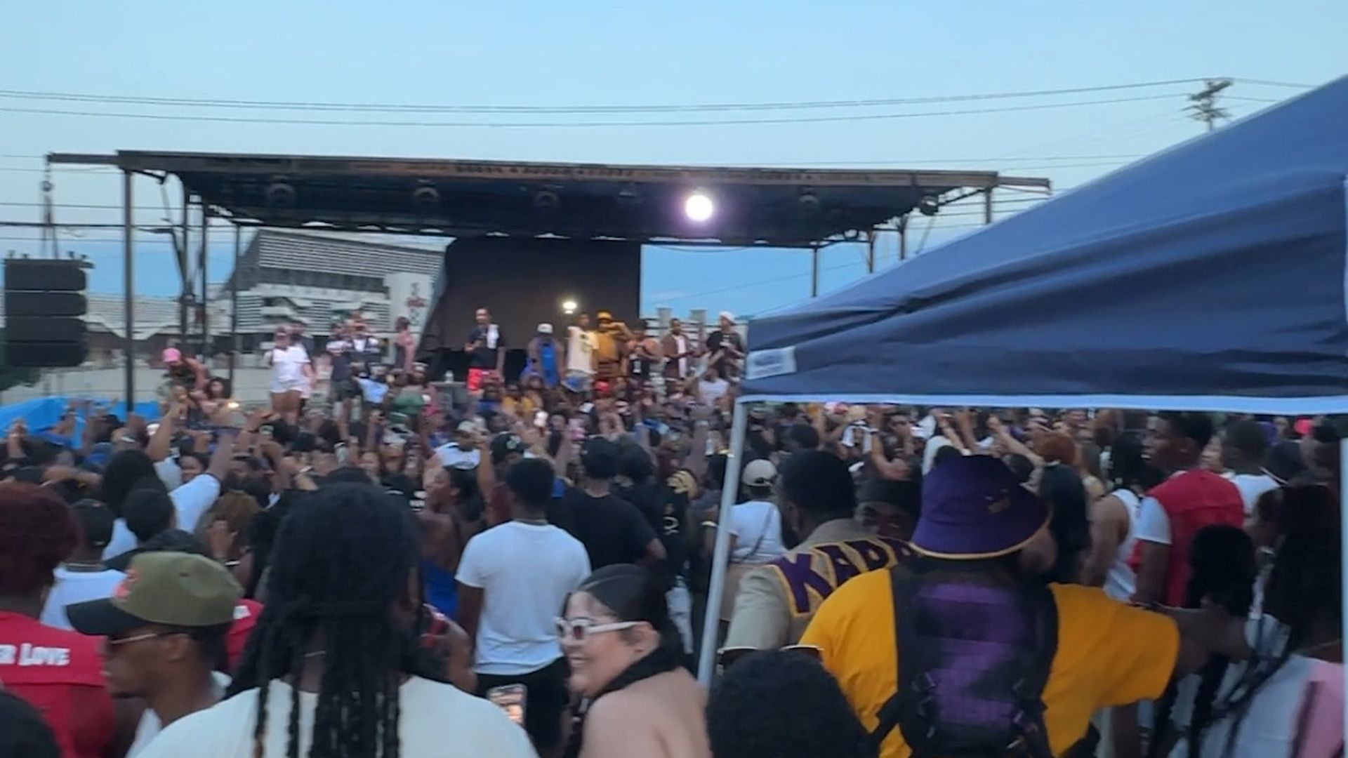 festival with a stage and large crowd