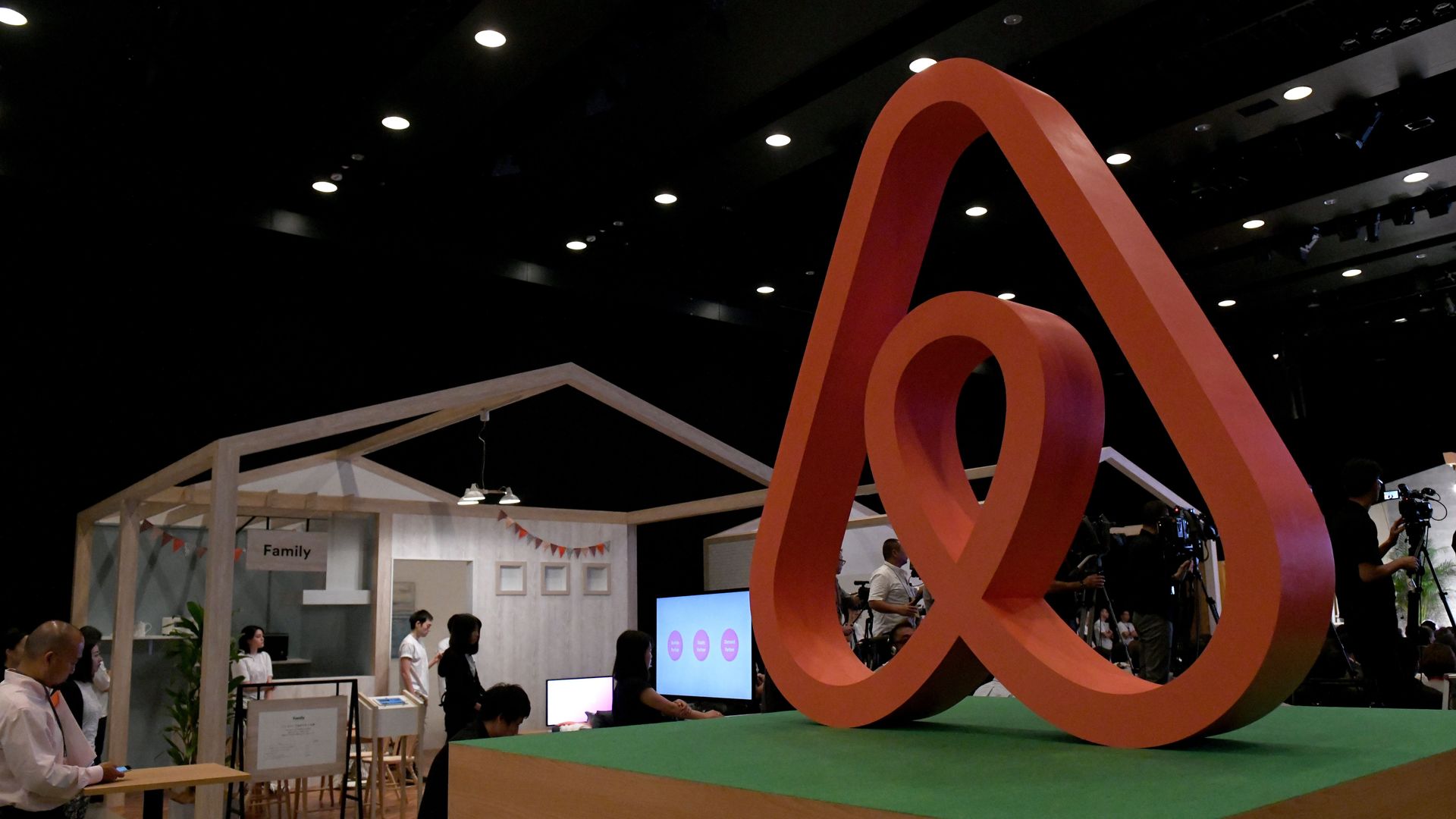 Photo of large Airbnb logo sculpture inside its Japan office. 