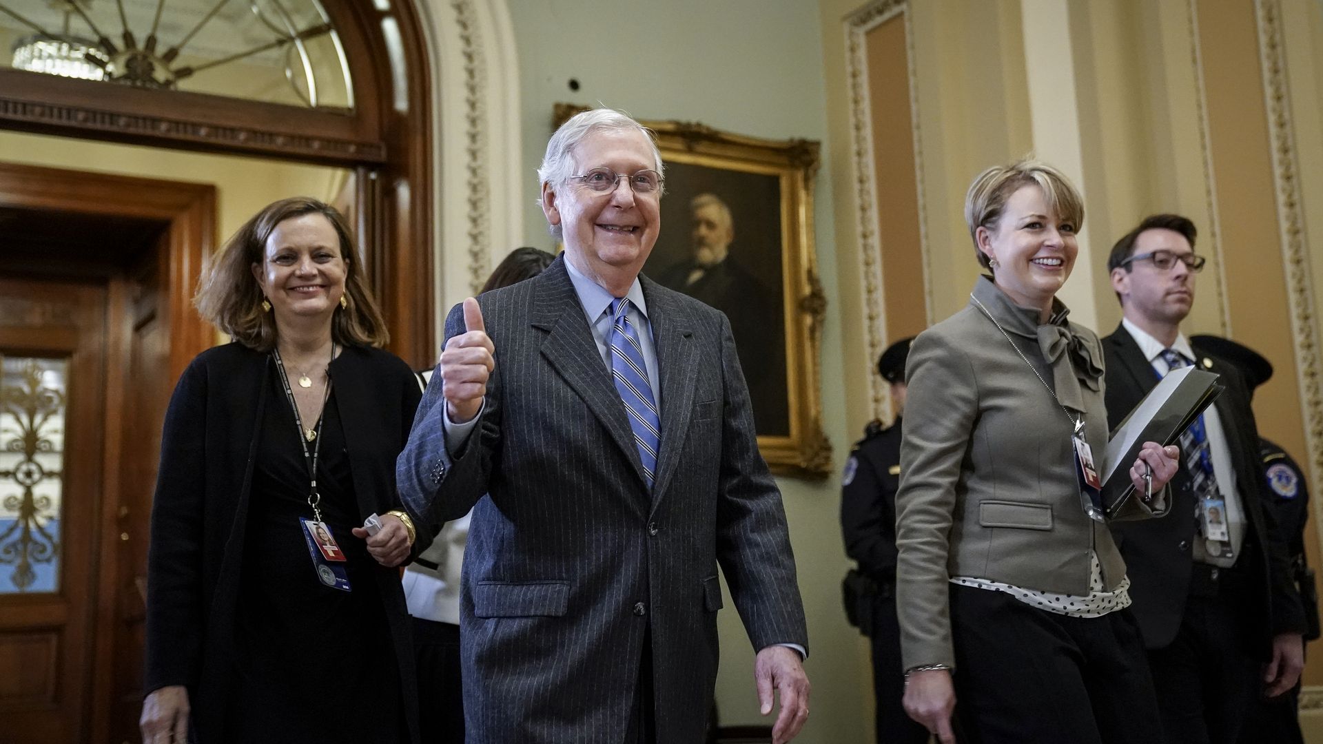 Senate Majority Leader Mitch McConnell (R-KY) gives the thumbs up as he leaves the Senate chamber.