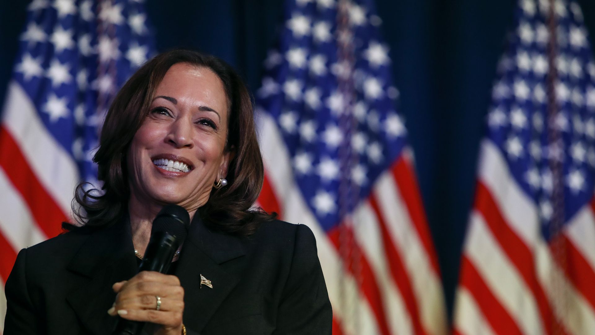 Kamala Harris speaks at a moderated conversation with former Trump administration national security official Olivia Troye and former Republican voter Amanda Stratton on July 17, 2024 in Kalamazoo, Michigan. Harris' visit, following the attempted assassination of former President Trump, makes this he