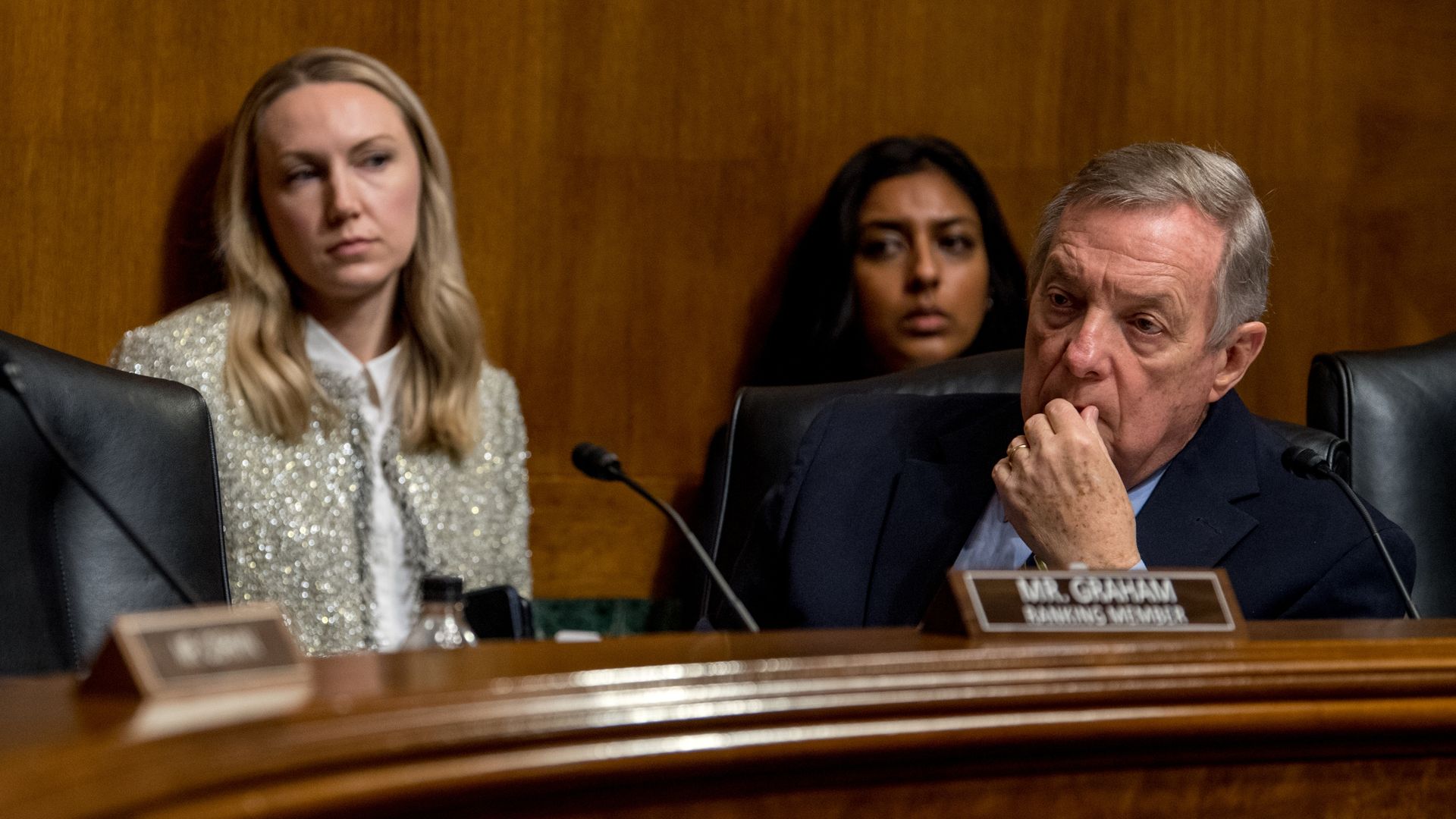 Sen. Dick Durbin, wearing a dark blue suit and blue shirt, sits behind the dais at a committee hearing.