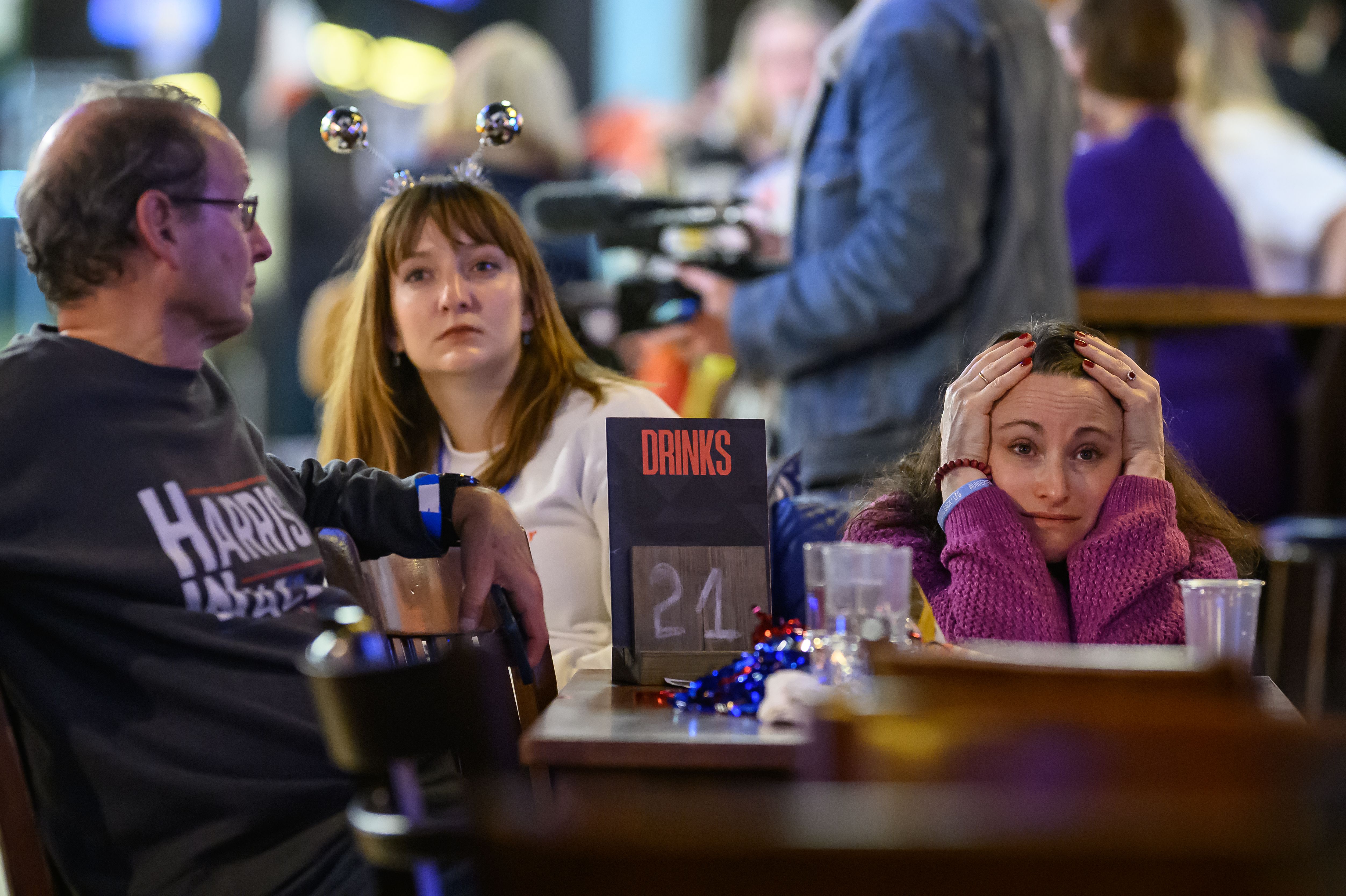  Supporters of Democratic presidential nominee, U.S. Vice President Kamala Harris, react as results are displayed during a "Democrats Abroad" election party on November 06, 2024 in London, England. 
