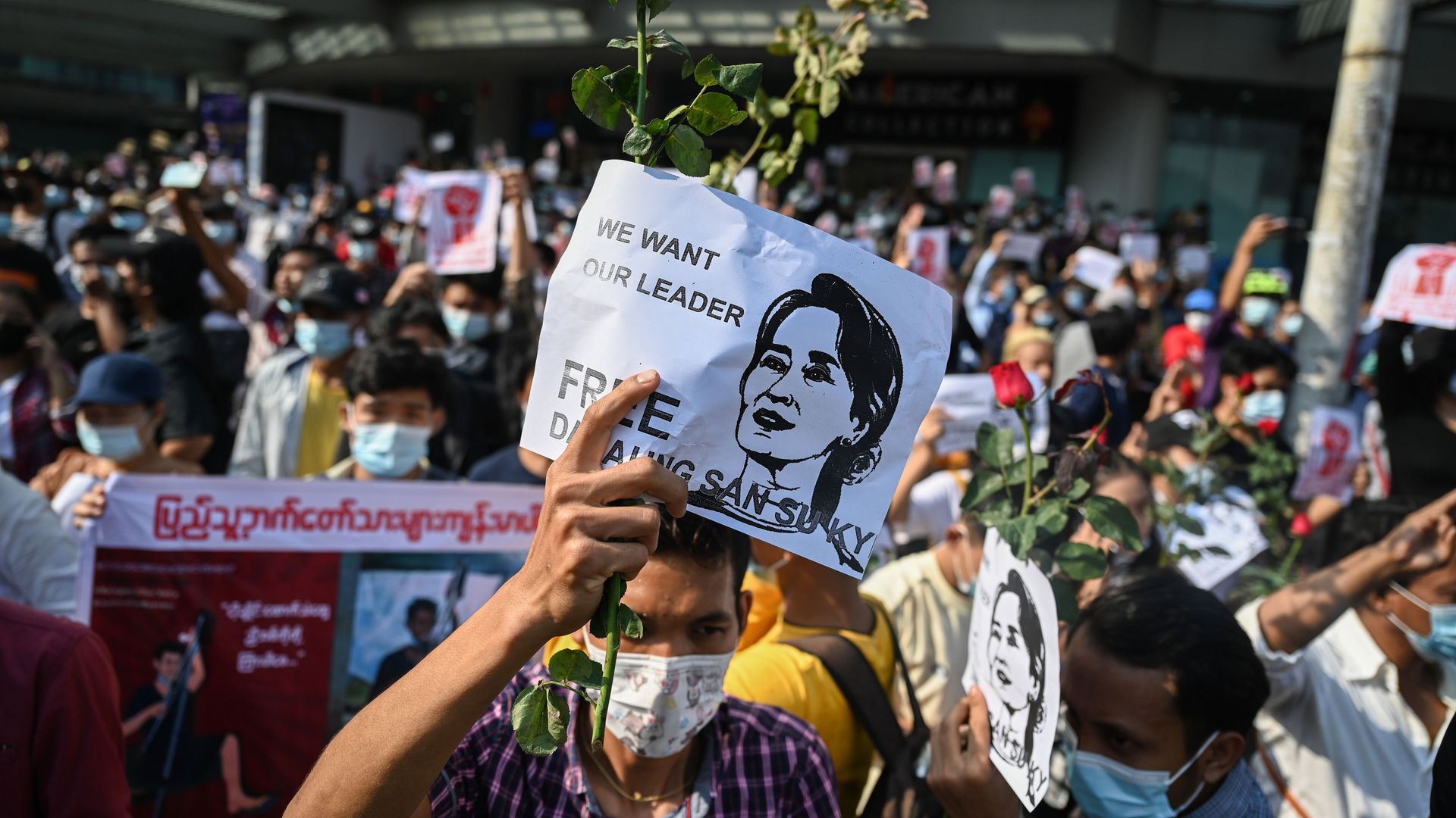 A protester holds up a sign calling for the release of detained civilian leader Aung San Suu Kyi during a demonstration against the military coup in Yangon on February 7
