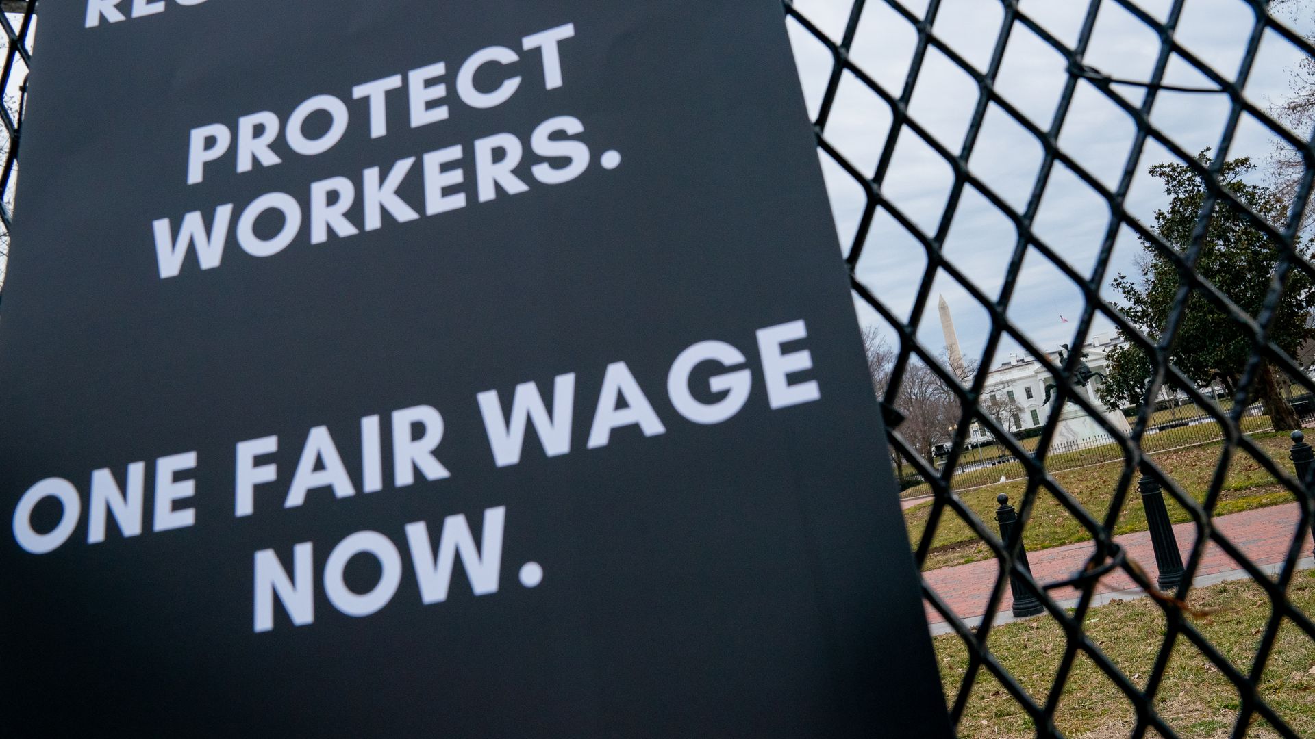 Picture of a poster demanding "fair wage" seen near the White House