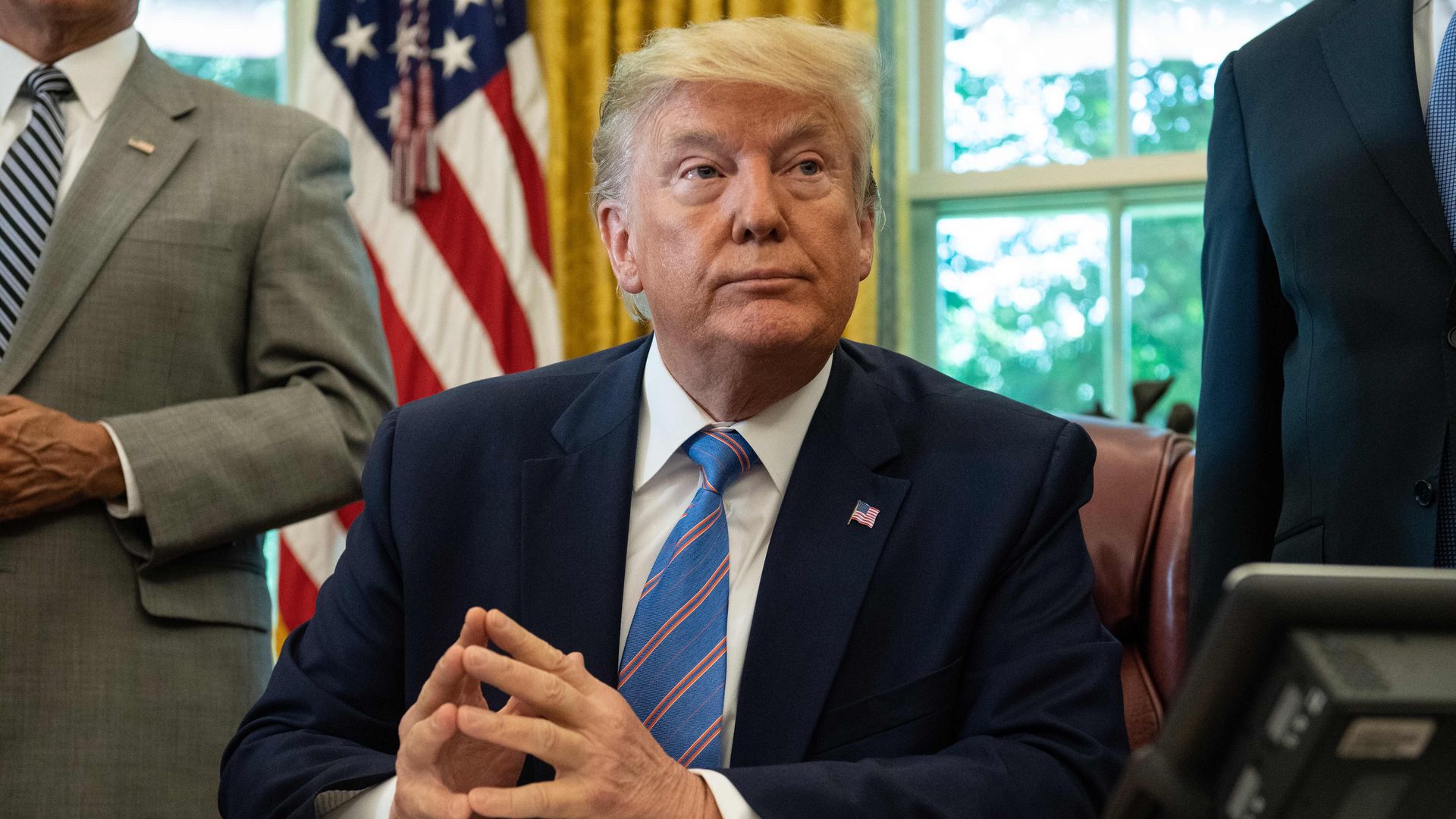 President Donald Trump speaks to the press before signing a bill for border funding legislationin in the Oval Office at the White House in Washington, DC, on July 1, 2019.
