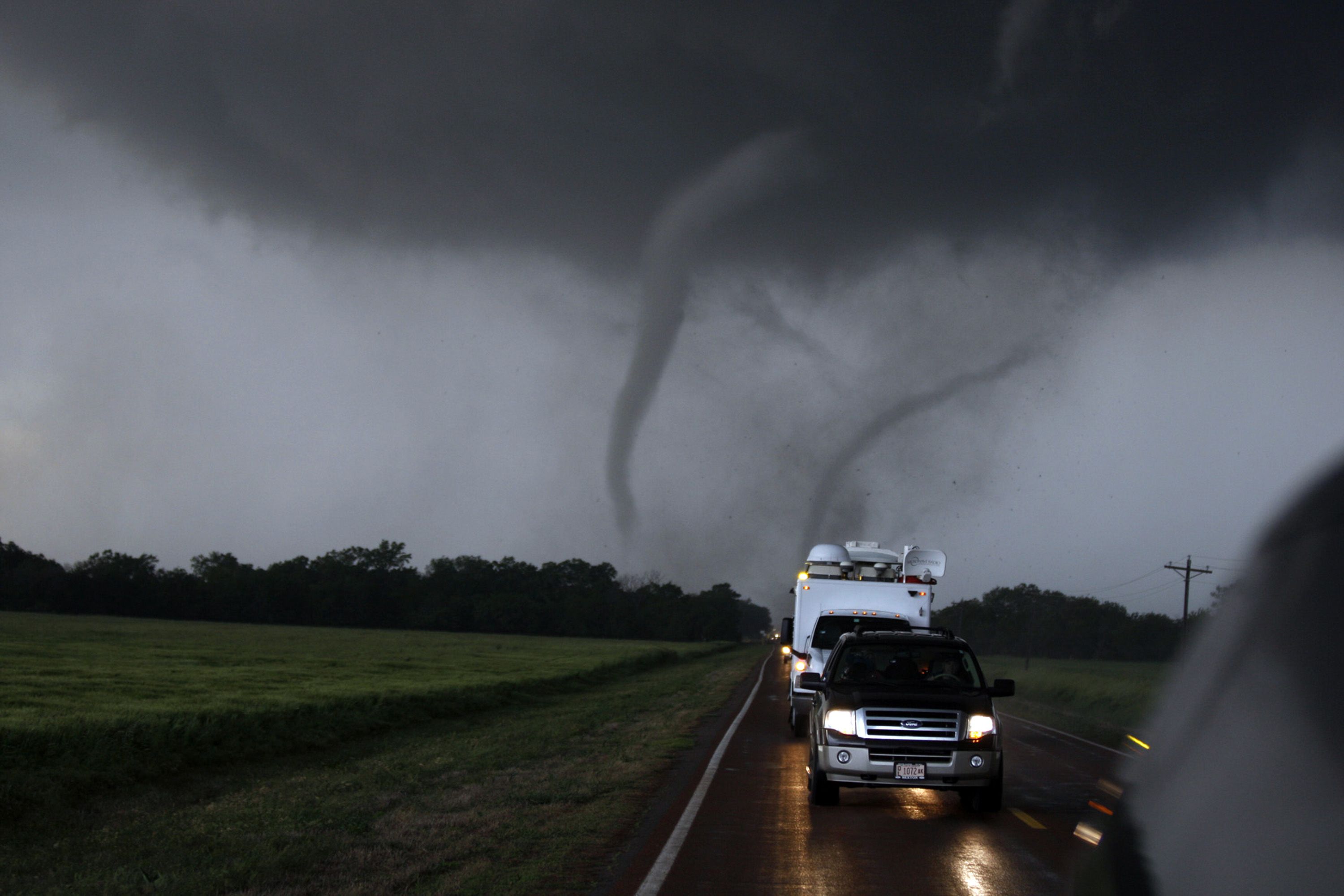 Photo of cars chasing a tornado