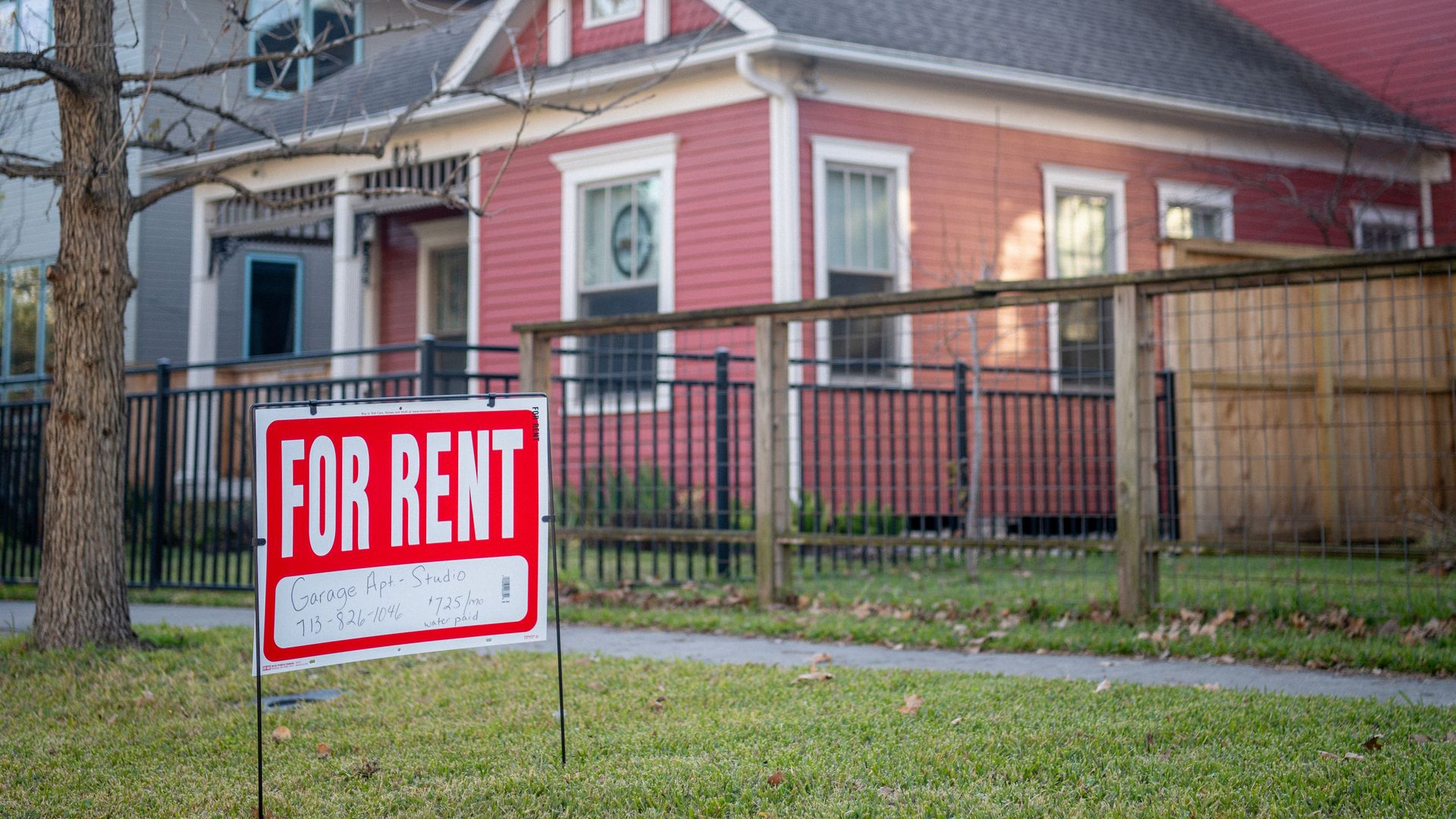 A Houston home with a "For Rent" sign out front