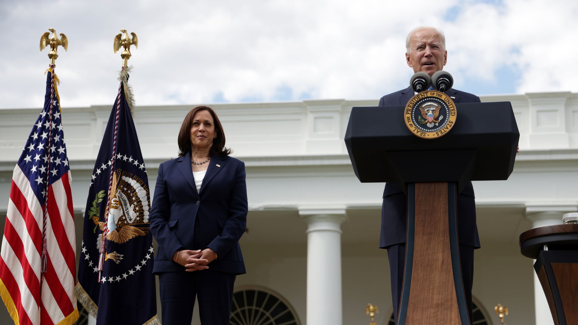 Photo of Joe Biden speaking from a podium outside the White House