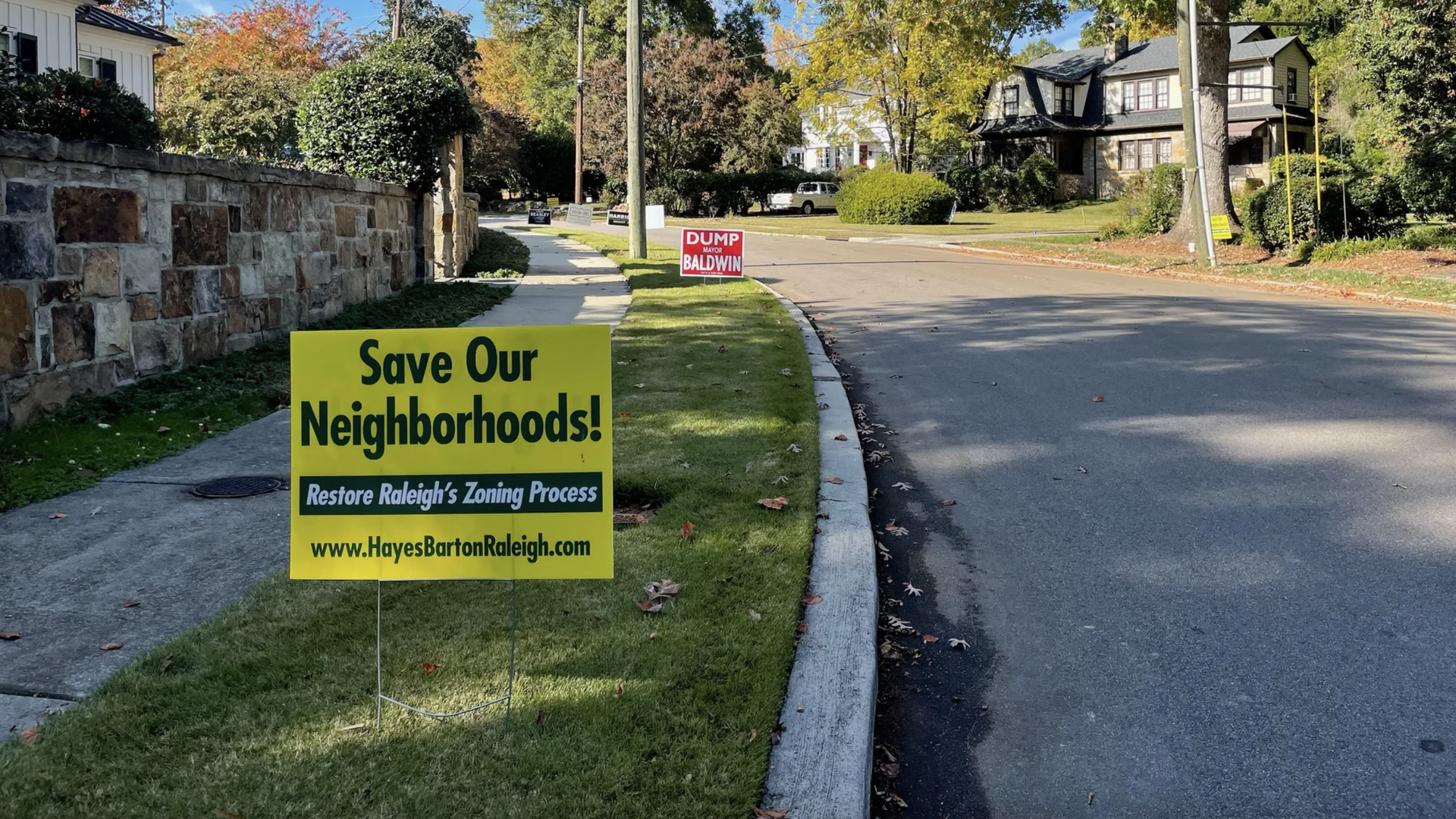 Campaign signs in the Hayes Barton neighborhood. Photo: Lucille Sherman/Axios
