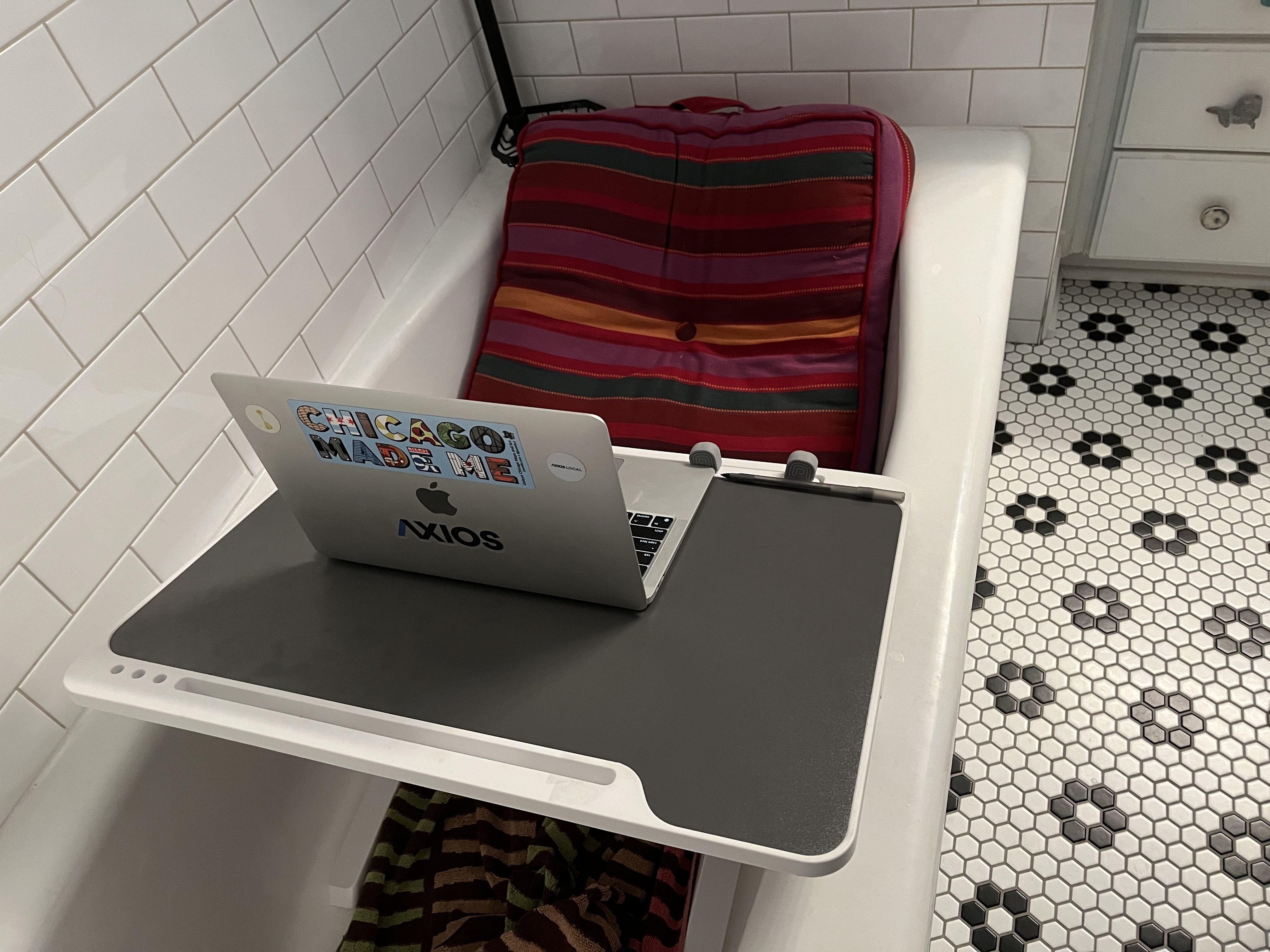 Photo of a bathtub with a computer 