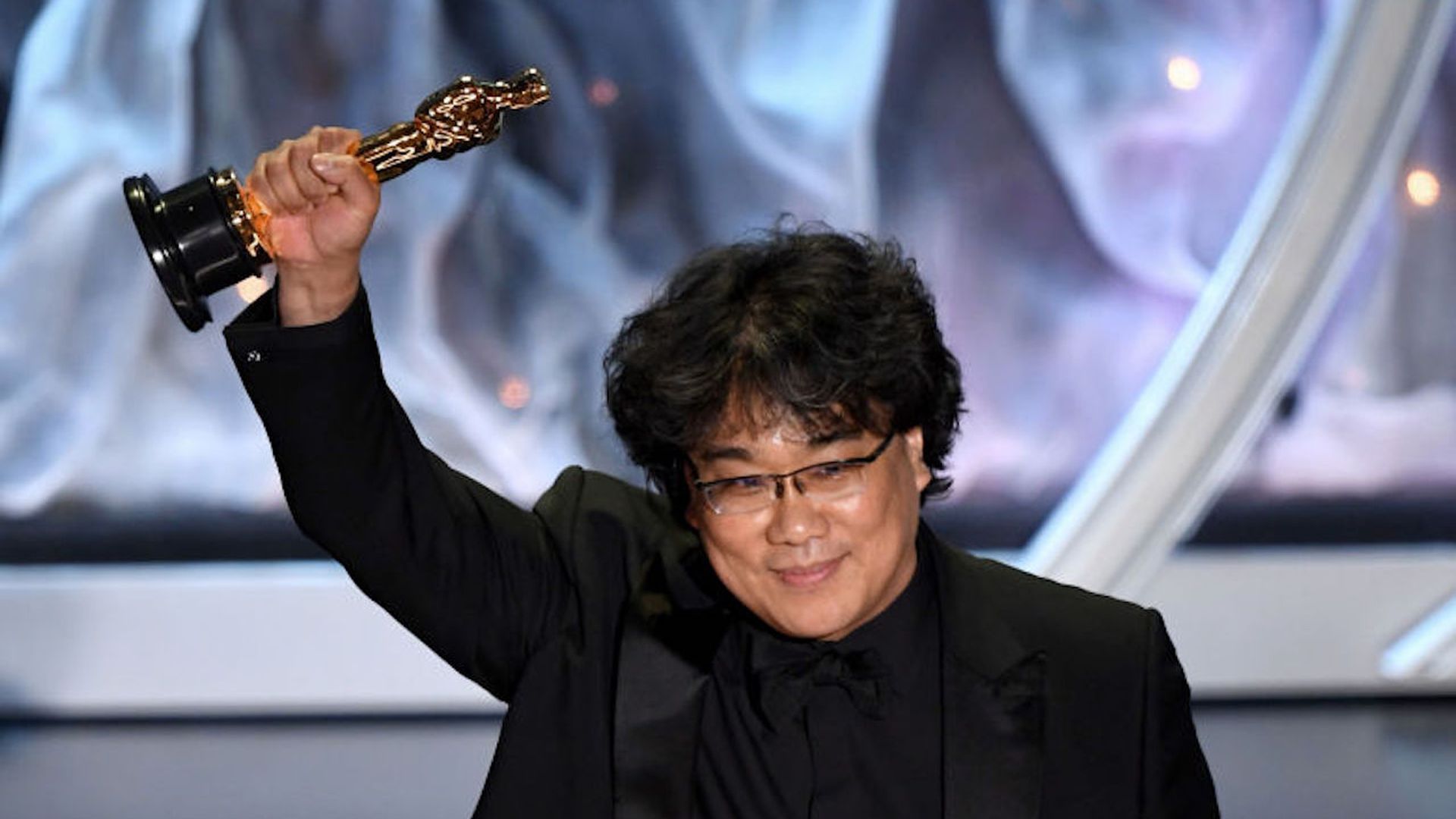 'Parasite' Director Bong Joon-ho accepting an award for 'Parasite' onstage during the 92nd Annual Academy.