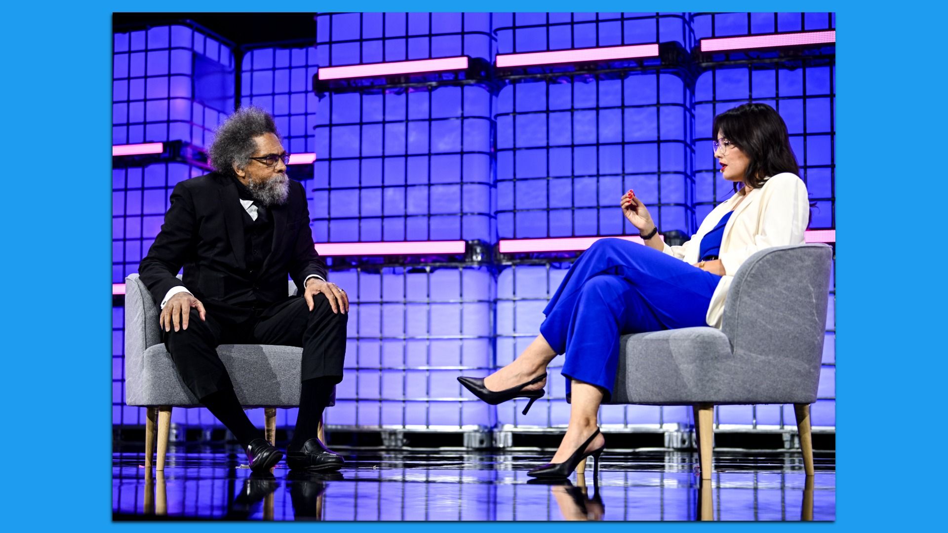 An image of Dr. Cornel West (left) and Axios reporter Sam Sabin on stage at Web Summit Vancouver.