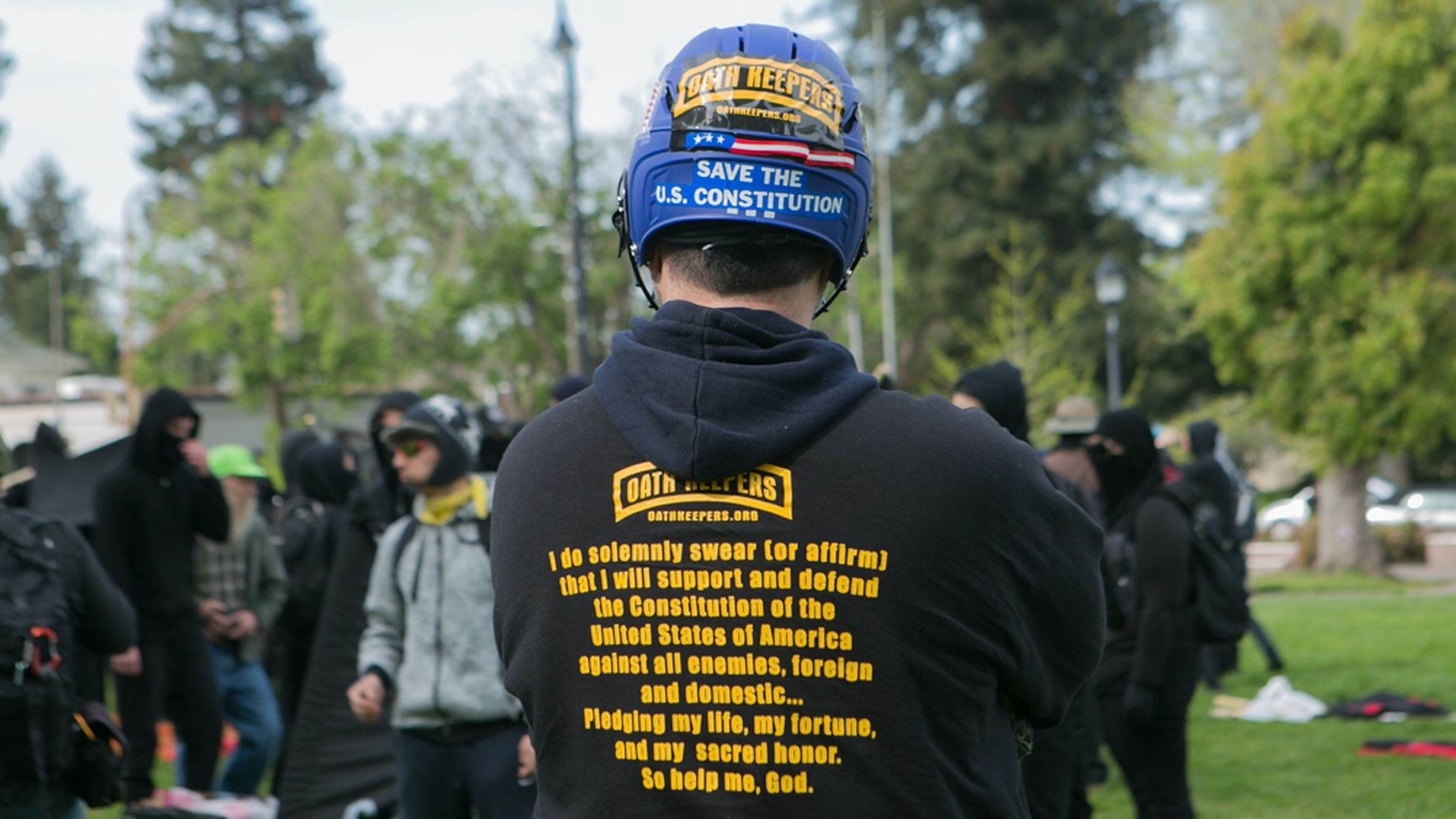 An Oathkeeper stands before a group of anti-fascists during a free speech rally at Martin Luther King Jr. Civic Center Park in Berkeley, California, United States of America on April 15, 2017.