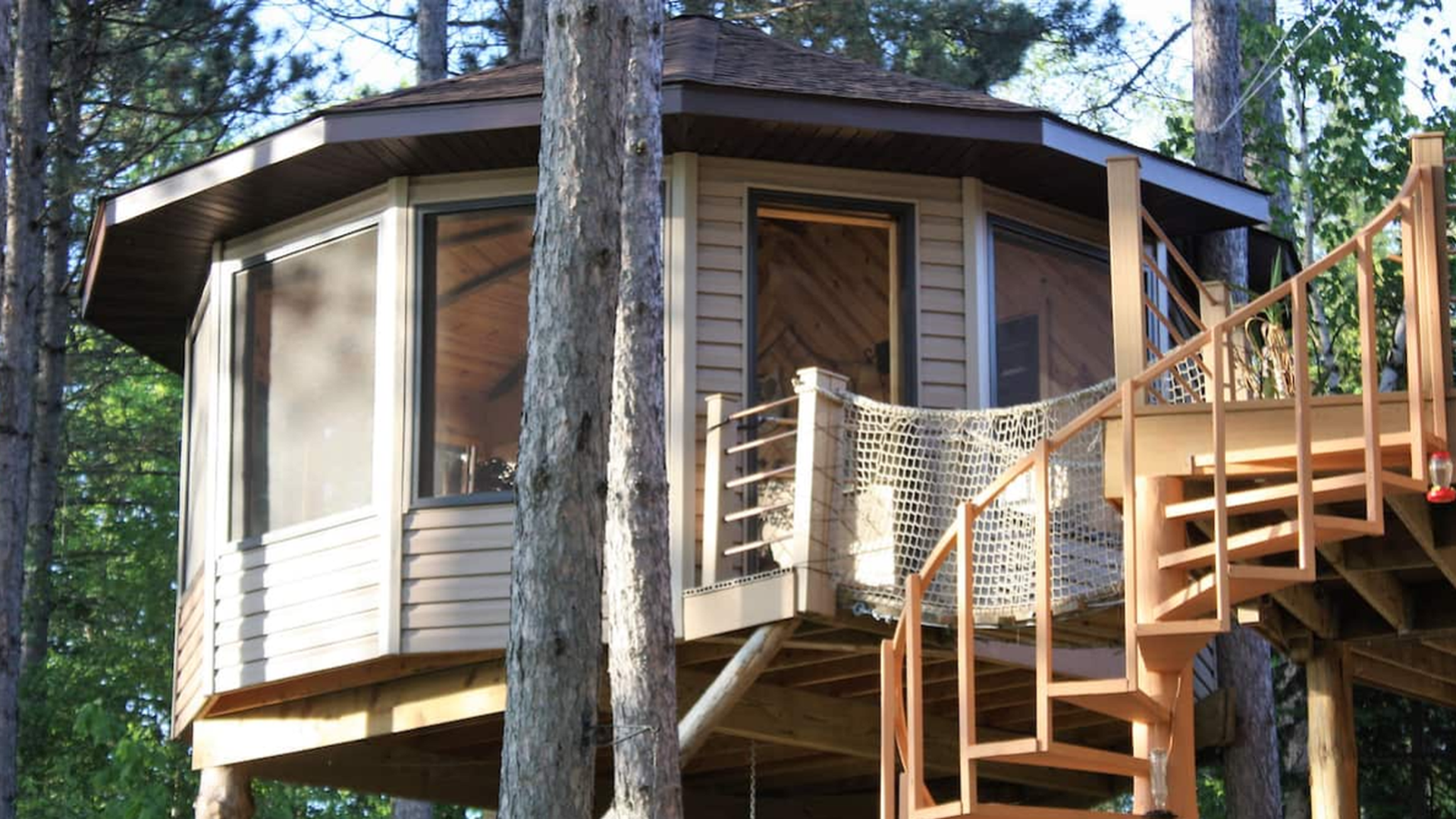 A Minnesota treehouse rental with a spiral staircase.