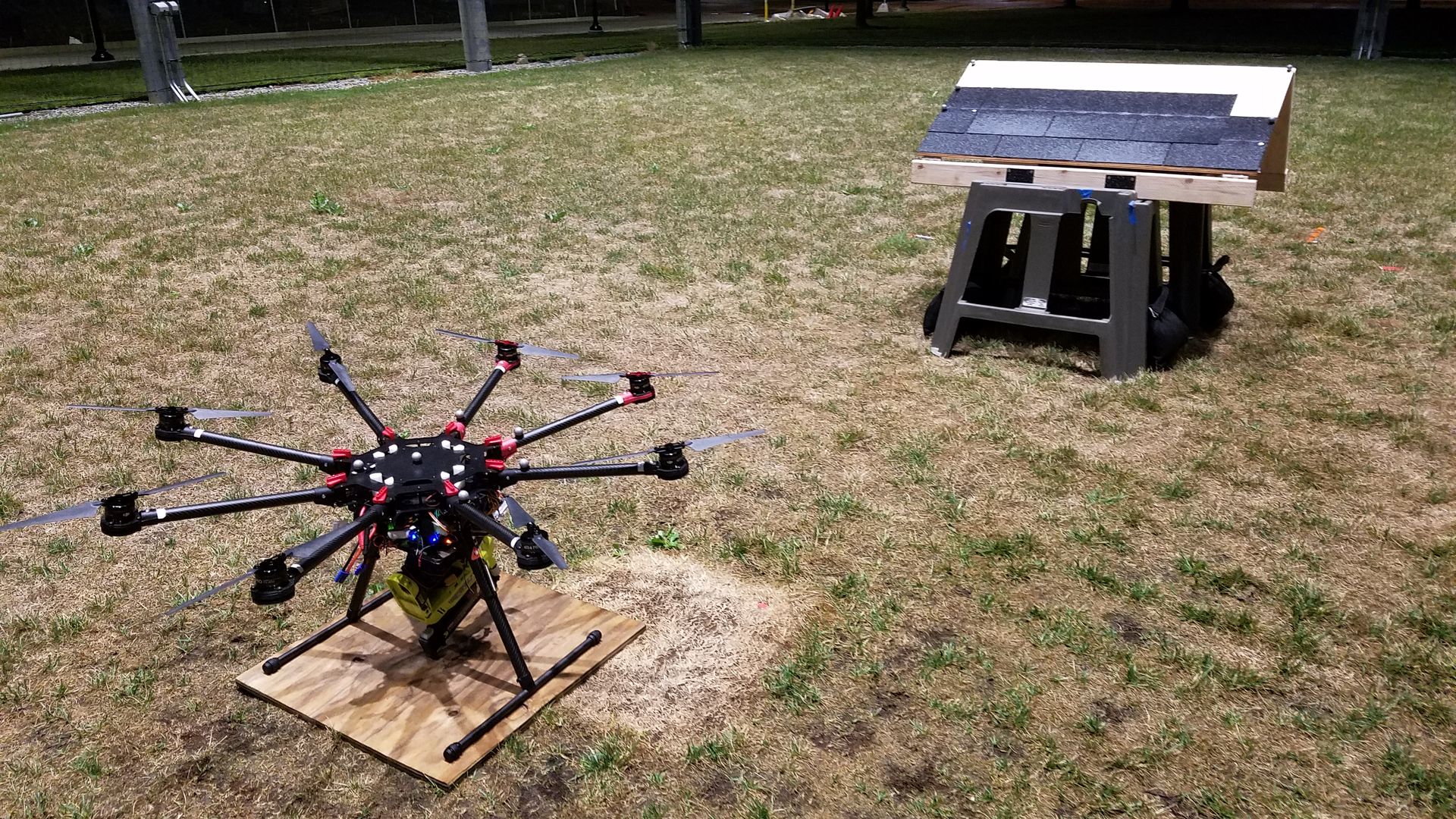 Image of a drone on the ground near a small section of roof