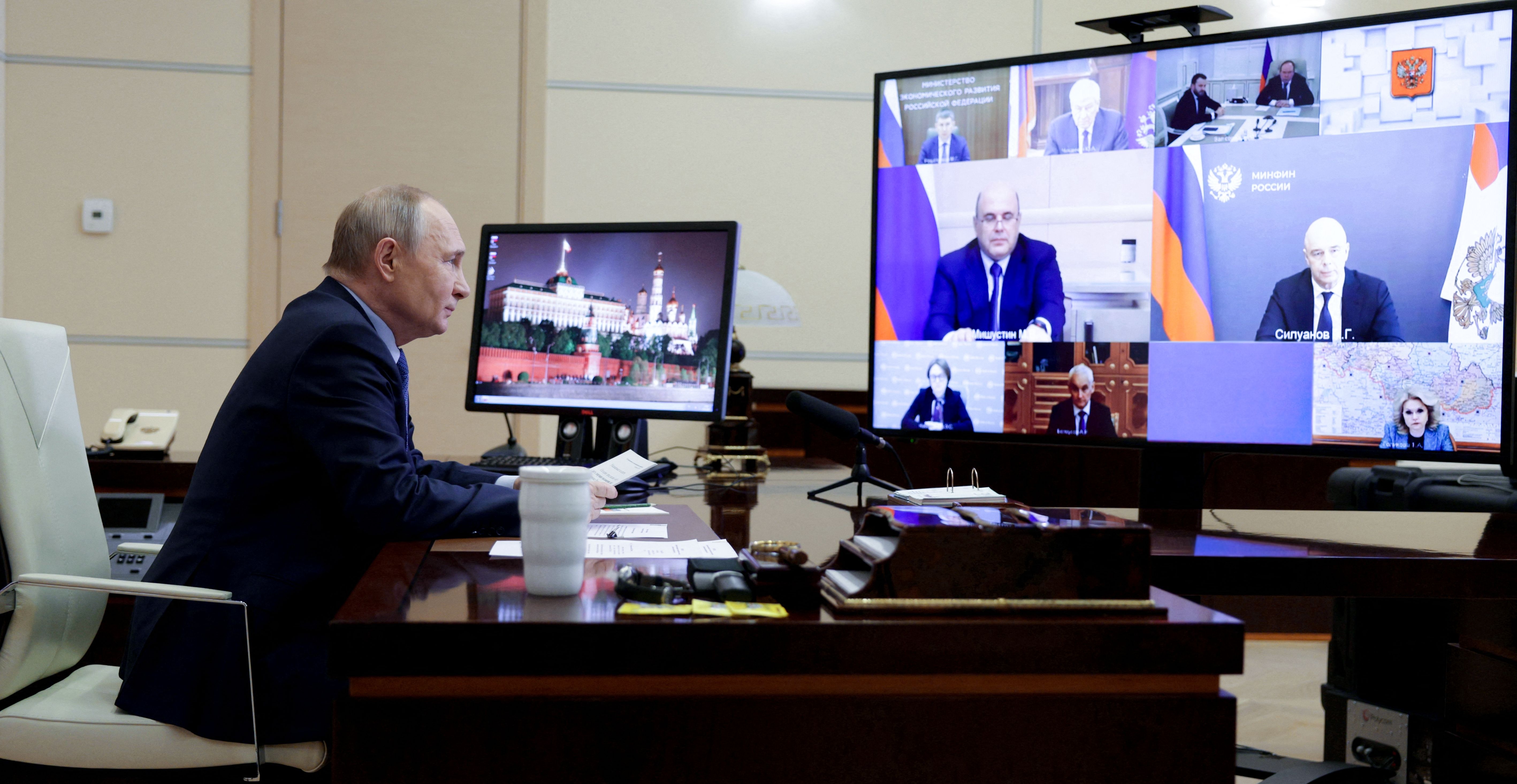 In this pool photograph distributed by Russian state owned agency President Vladimir Putin holds a meeting on economic issues via video link in Novo-Ogaryovo, on April 27, 2024. 
