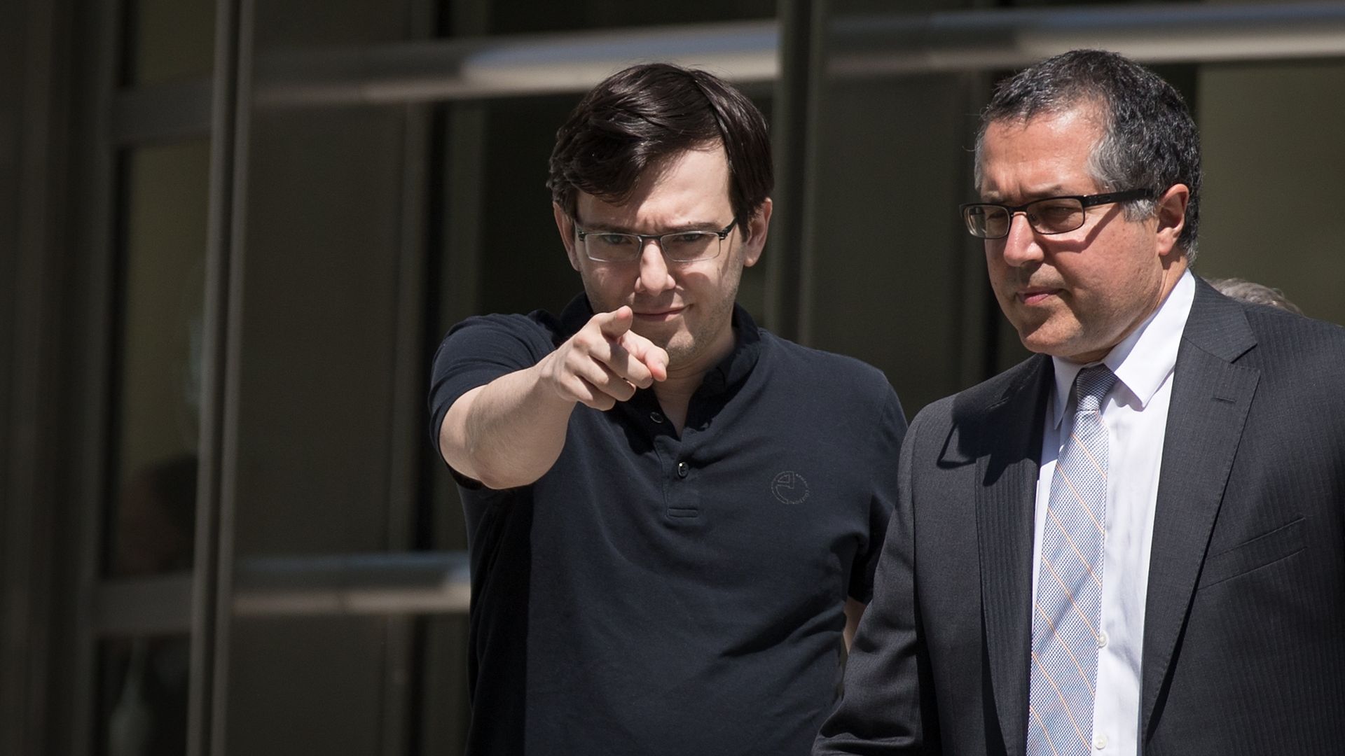 Matin Skreli pointing directly into the camera