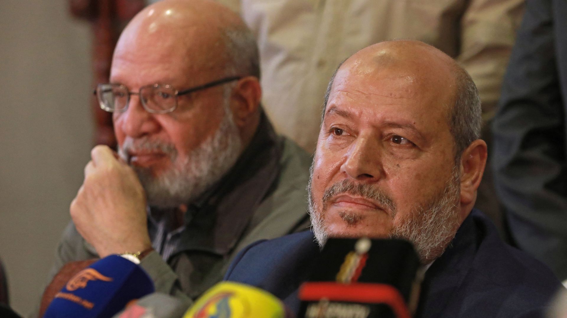 Hamas arab relations chief Khalil al-Hayya (R) and Abdulaziz al-Minawi, senior official of the Palestinian Islamic Jihad movement, hold a press conference during a visit to the Syrian capital Damascus