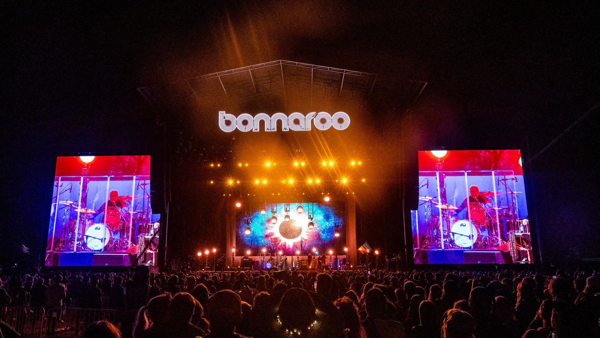 The stage at Bonnaroo surrounded by fans.